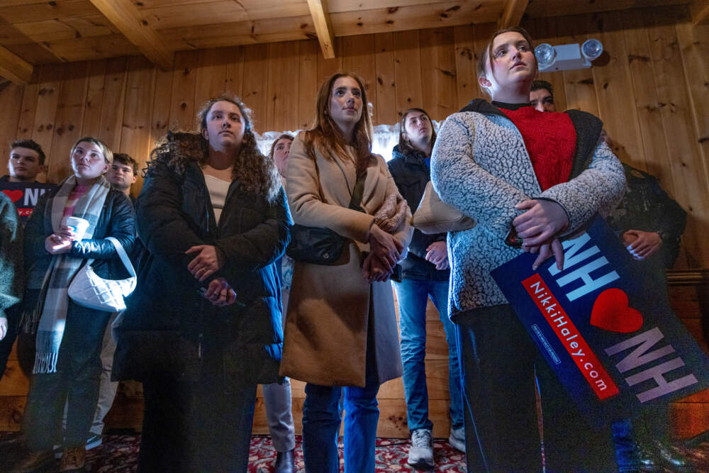 Supporters watch and listen as Republican presidential candidate an Nikki Haley speaks during a campaign event at the Alpine Grove Event Center in Hollis, N.H. (Jesse Costa/WBUR)