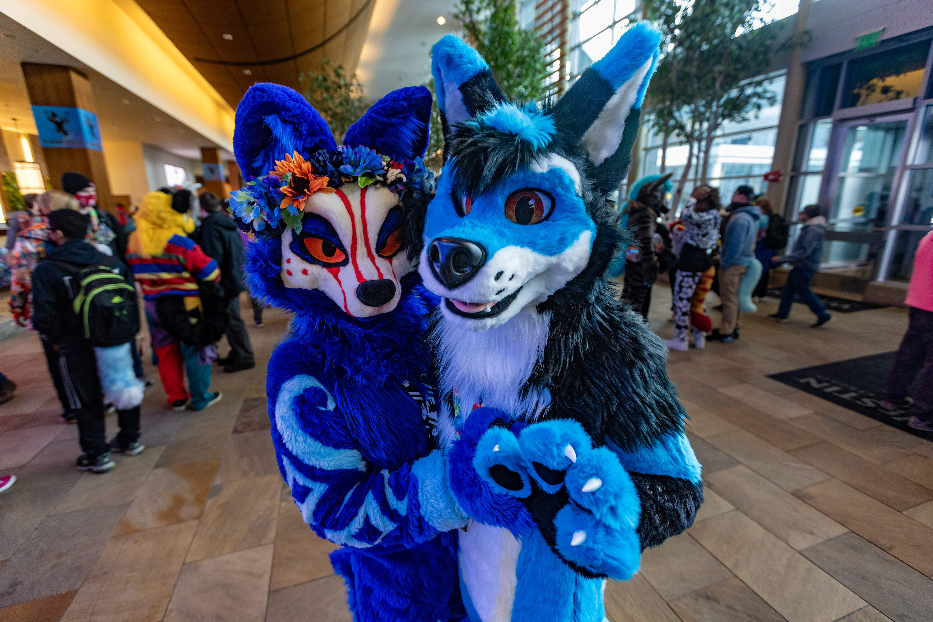 Lanari, a wolf, hails from New Jersey and came with Kalas the coyote. (Neither attendee wanted to share their real name.) The social aspect of furry conventions appeals to them and they love that it's a creative, artistic community. They said their fursonas are "extensions of themselves." (Jesse Costa/WBUR)