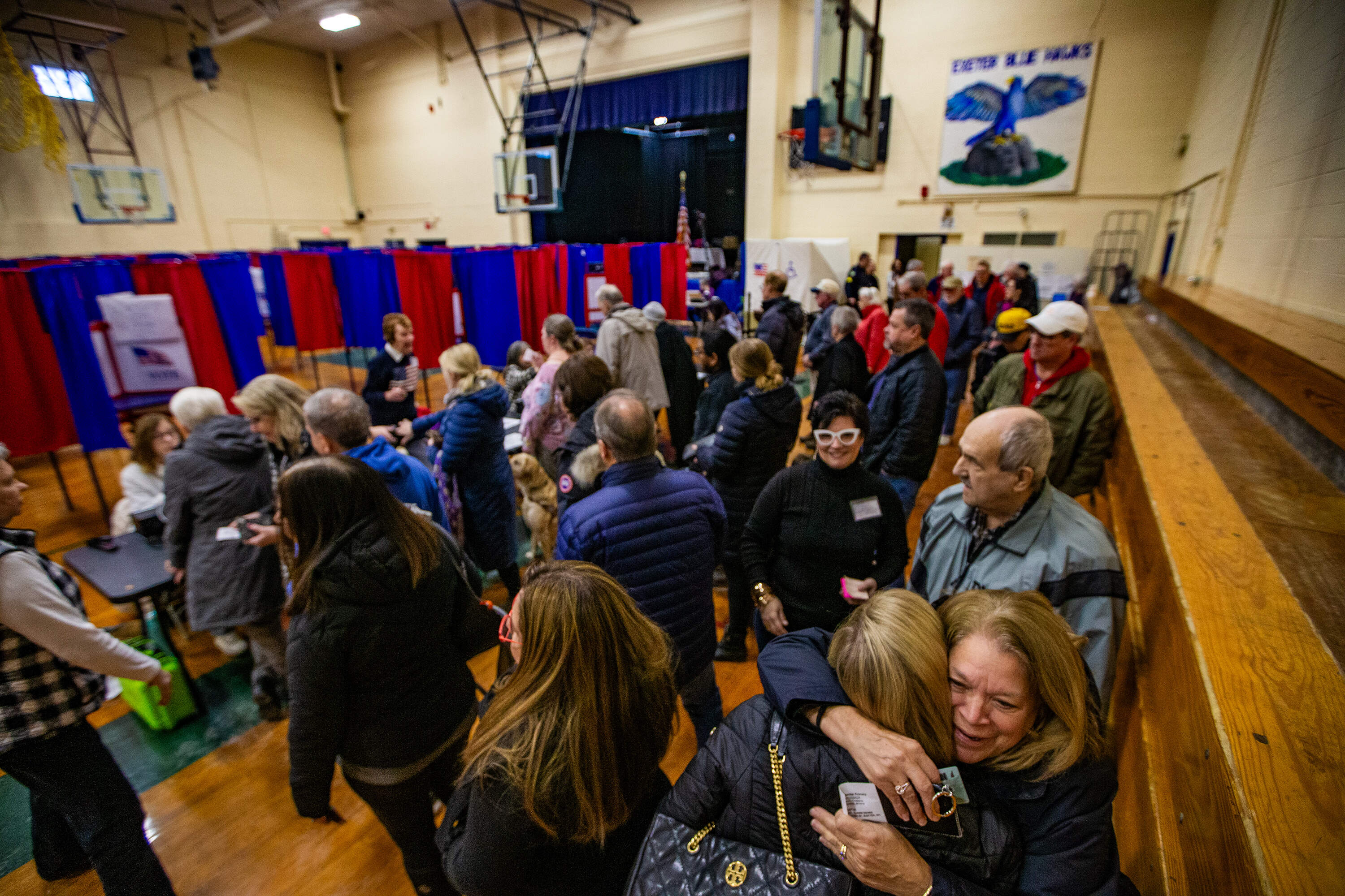 Voters line up to register to vote at the Talbot Gym in Exeter. (Jesse Costa/WBUR)