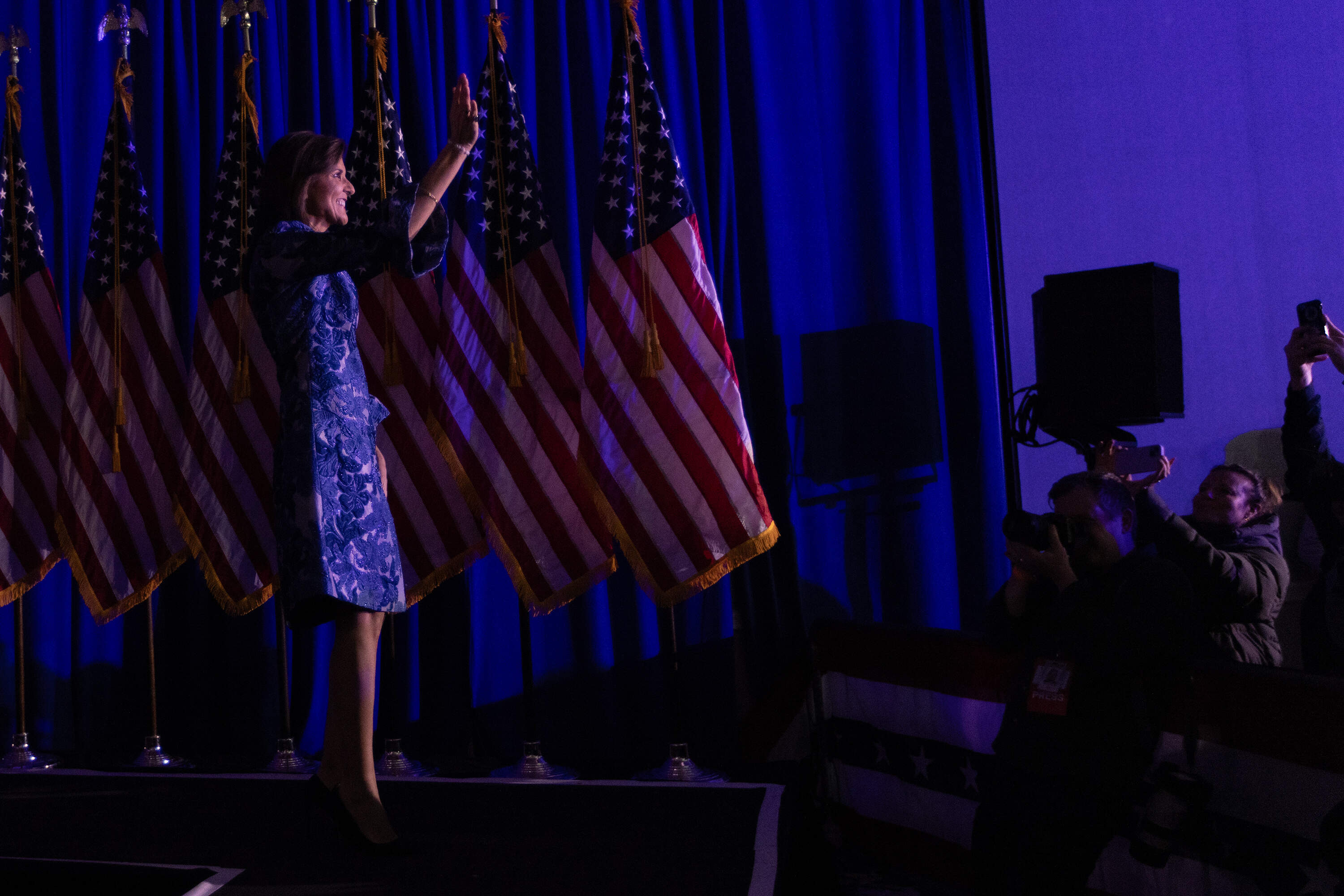 Nikki Haley waves to supporters after she lost the New Hampshire primary during her election night party at Grappone Conference Center in Concord. (Jesse Costa/WBUR)