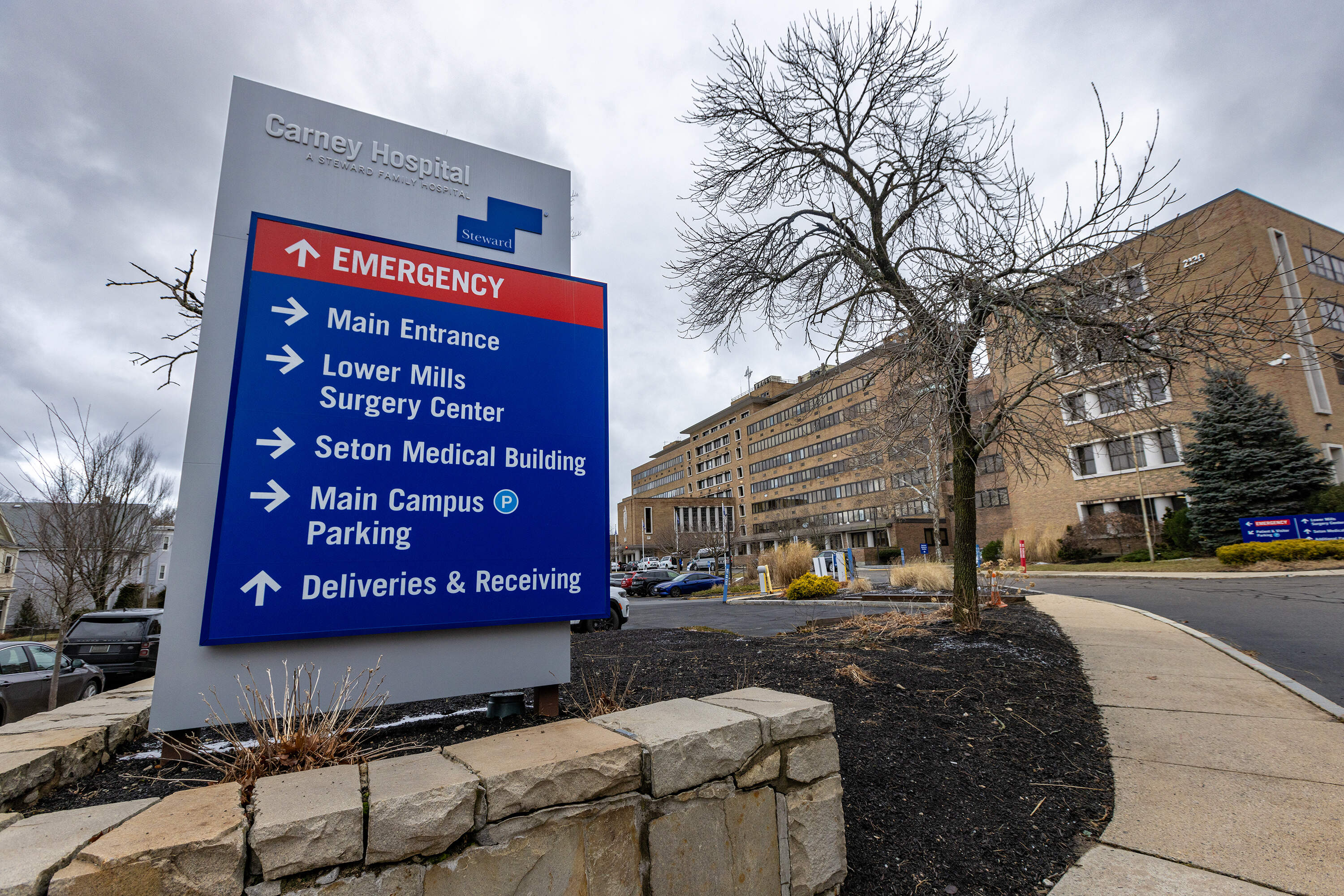Massachusetts officials are preparing contingency plans to avoid closures at Steward Health Care facilities, which include the Carney Hospital in Dorchester. (Jesse Costa/WBUR)