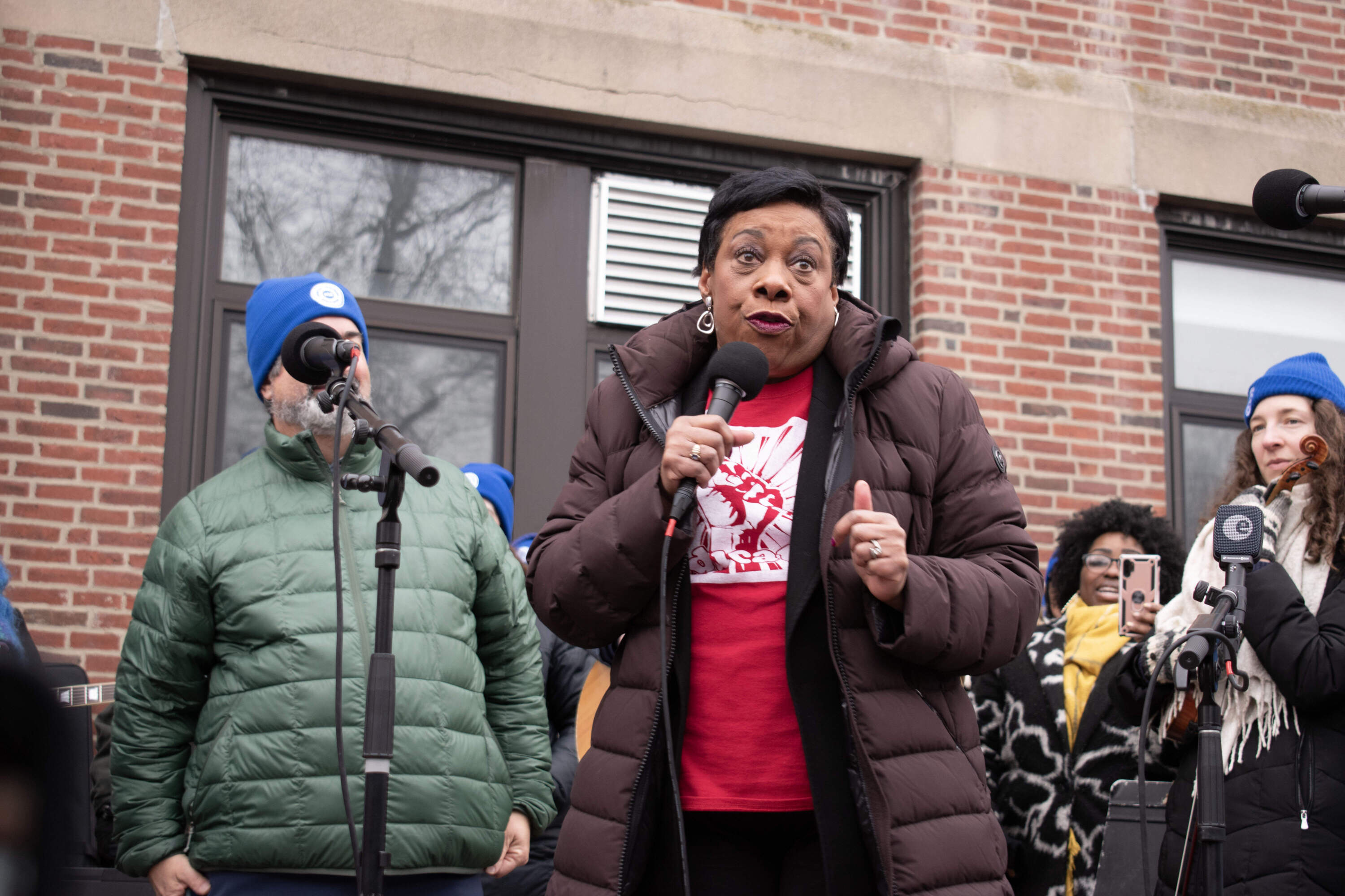 Rebecca Pringle, the president of the National Education Association, addresses a crowd of Newton educators and their supporters at a rally Wednesday morning. (Meghan Kelly/WBUR)