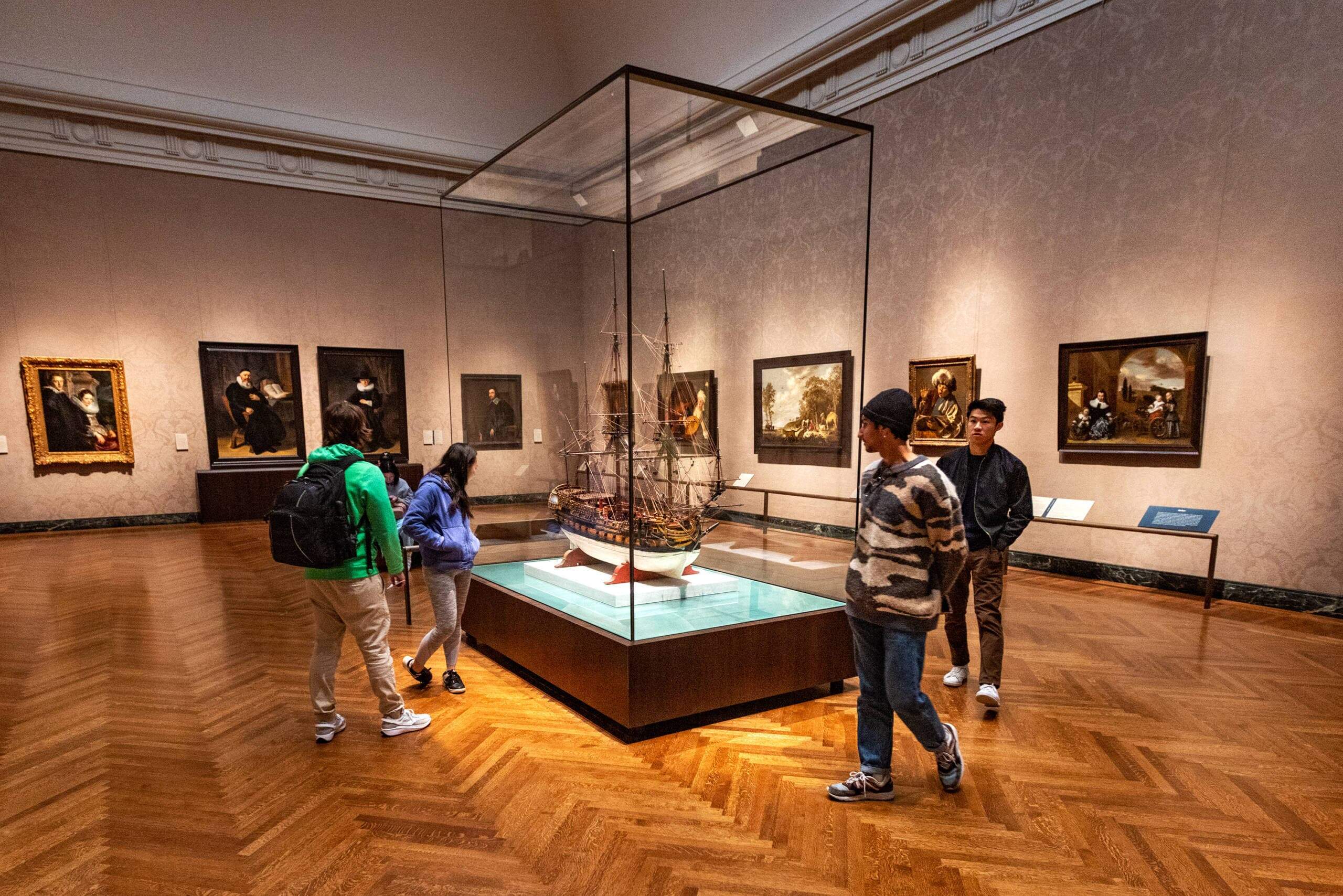 Museum patrons in the Dutch and Flemish room at the Museum of Fine Arts, Boston. (Jesse Costa/WBUR)