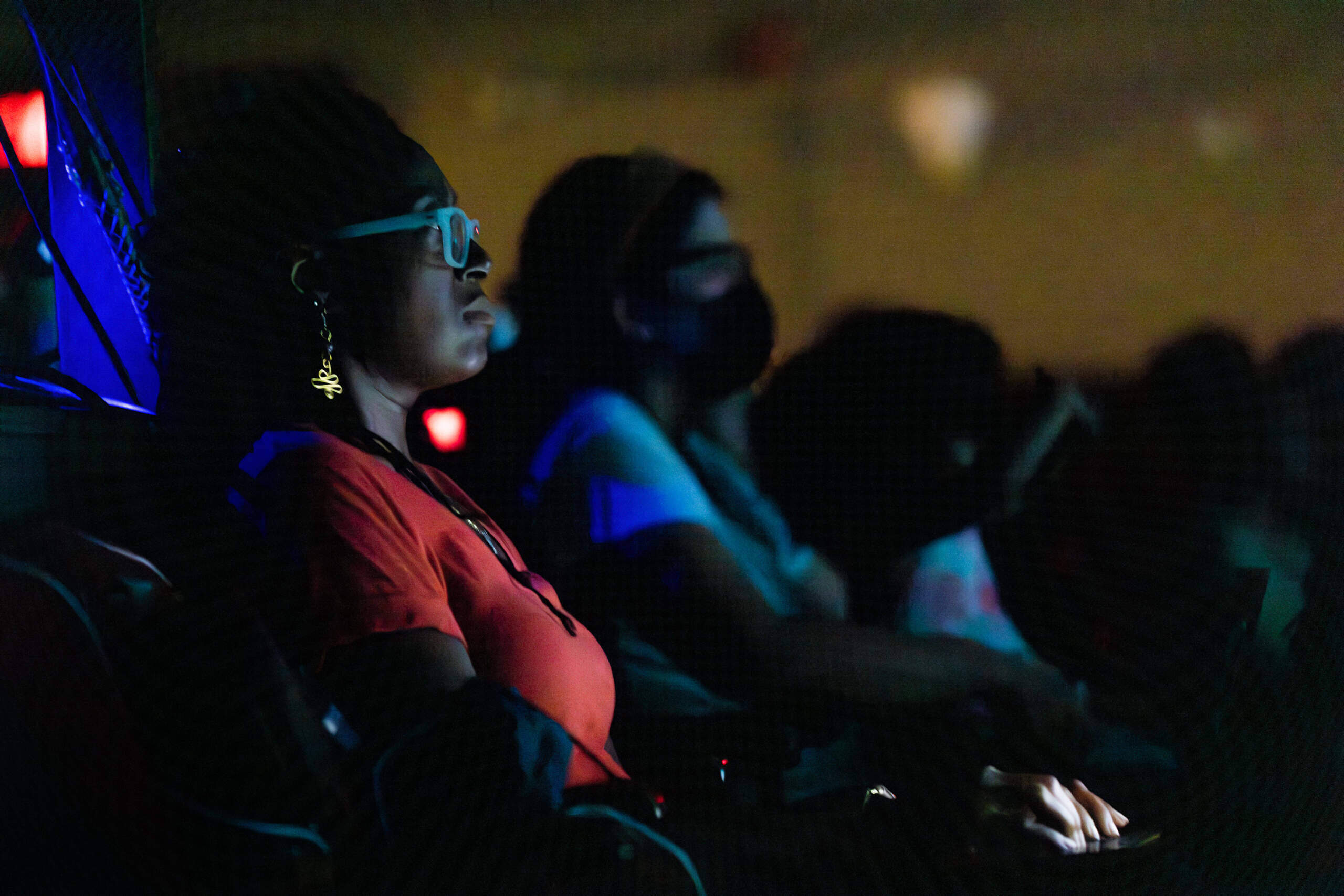 Company One associate artistic director Summer Williams watches the dress rehearsal of “The Boy Who Kissed the Sky” at the Strand Theater in 2023. (Jesse Costa/WBUR)