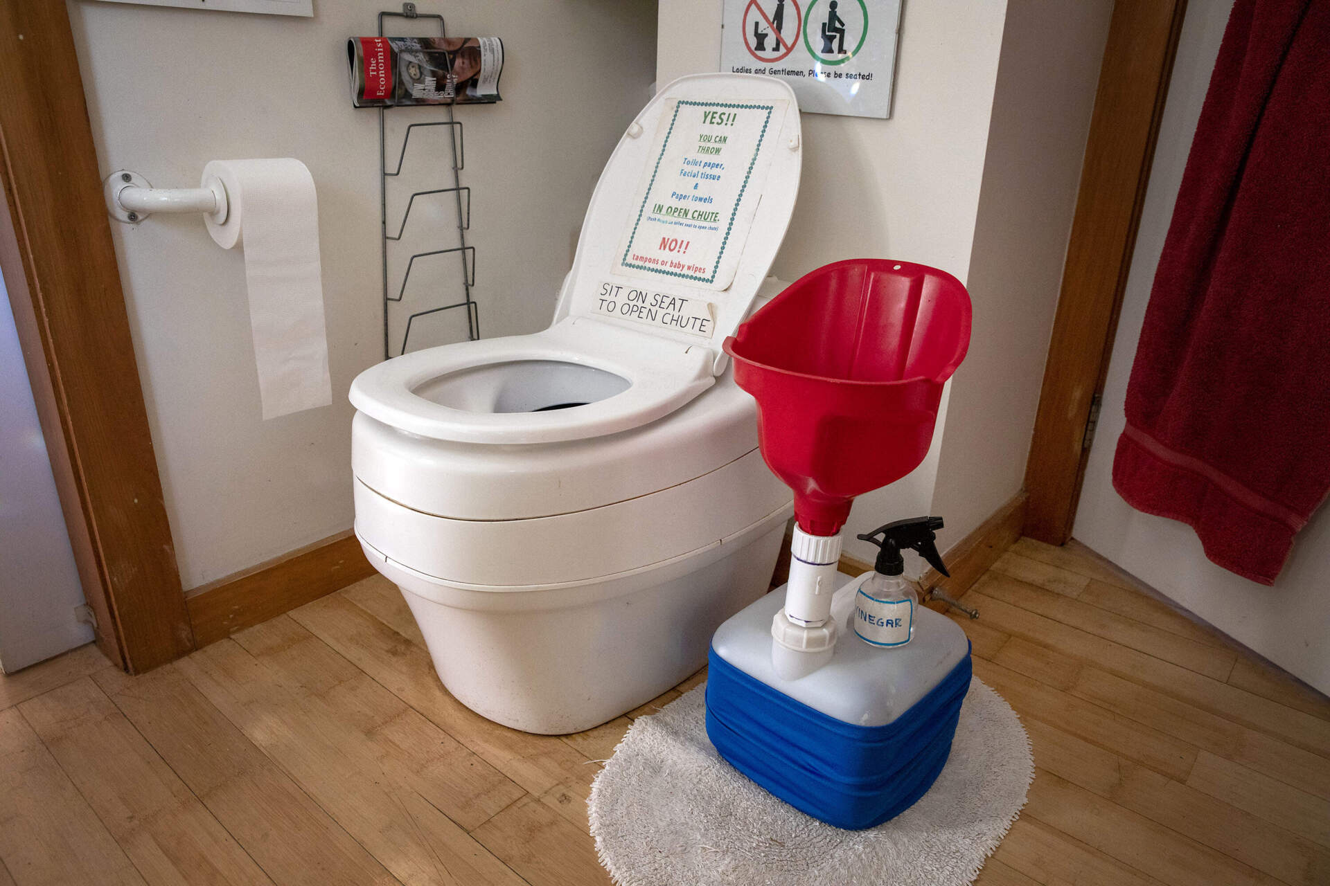 A composting toilet, which separates urine from other material, and a cubie unisex urinal, in the bathroom at the Green Center in East Falmouth, Mass.