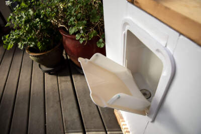 A wall mounted urinal on display at the Green Center in East Falmouth, Mass. (Robin Lubbock/WBUR)