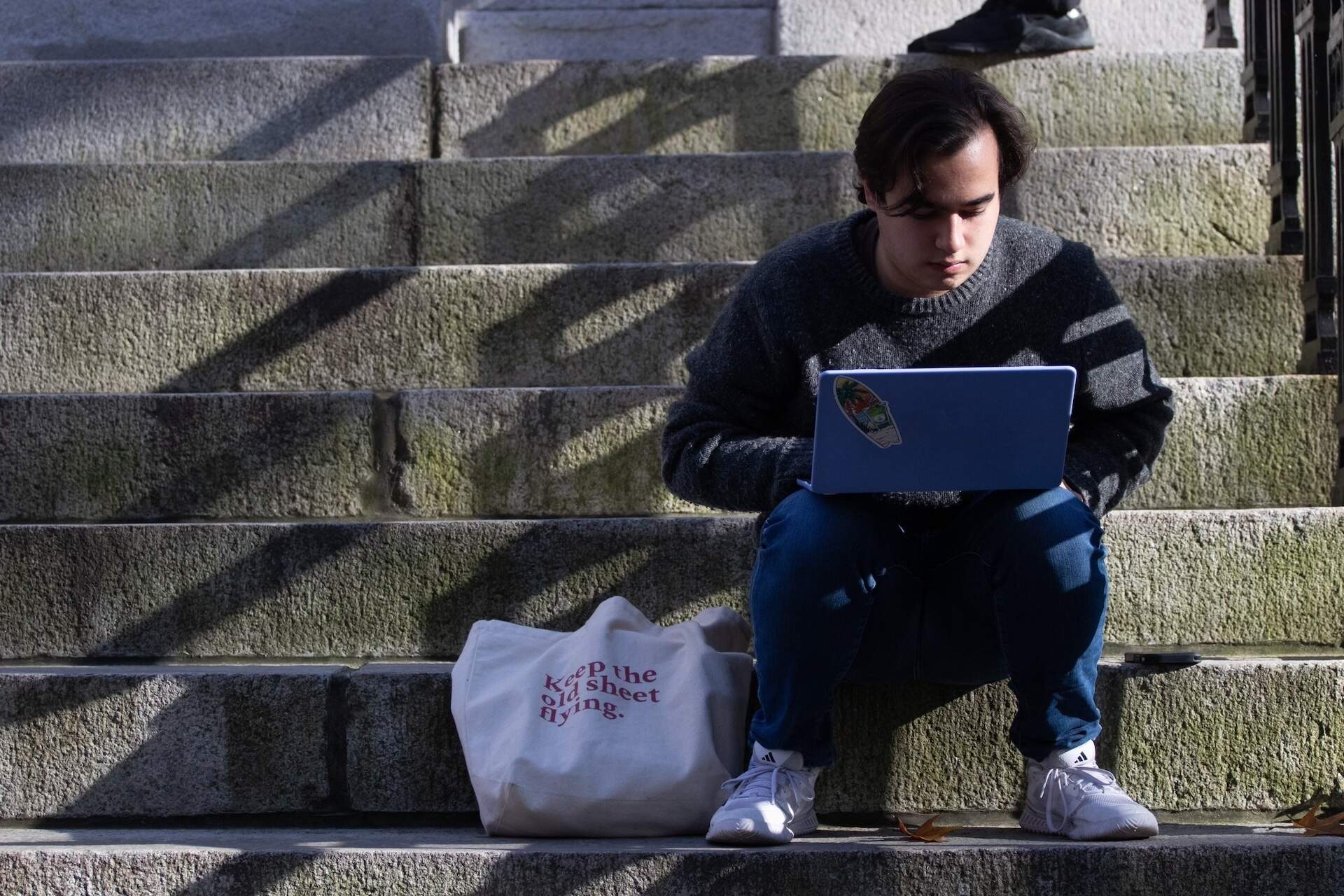 Elias Schisgall, co-associate managing editor for the Crimson, works on his laptop. (Courtesy The Harvard Crimson)