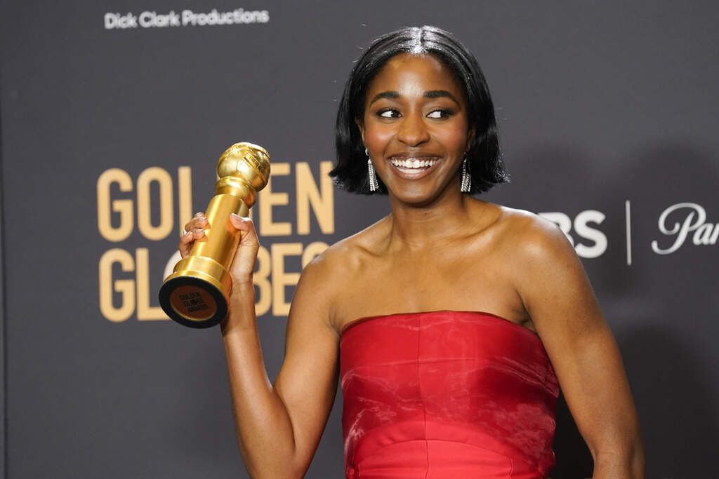 Ayo Edebiri poses in the press room with the award for best performance by an actress in a television series, musical or comedy for "The Bear" at the 81st Golden Globe Awards. (Chris Pizzello/AP)