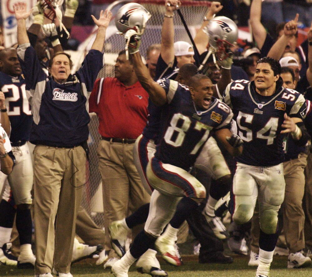 New England Patriots head coach Bill Belichick, left, celebrates his team's victory with players David Givens and Tedy Bruschi after winning Super Bowl XXXVIII. (Eric Gay/AP)