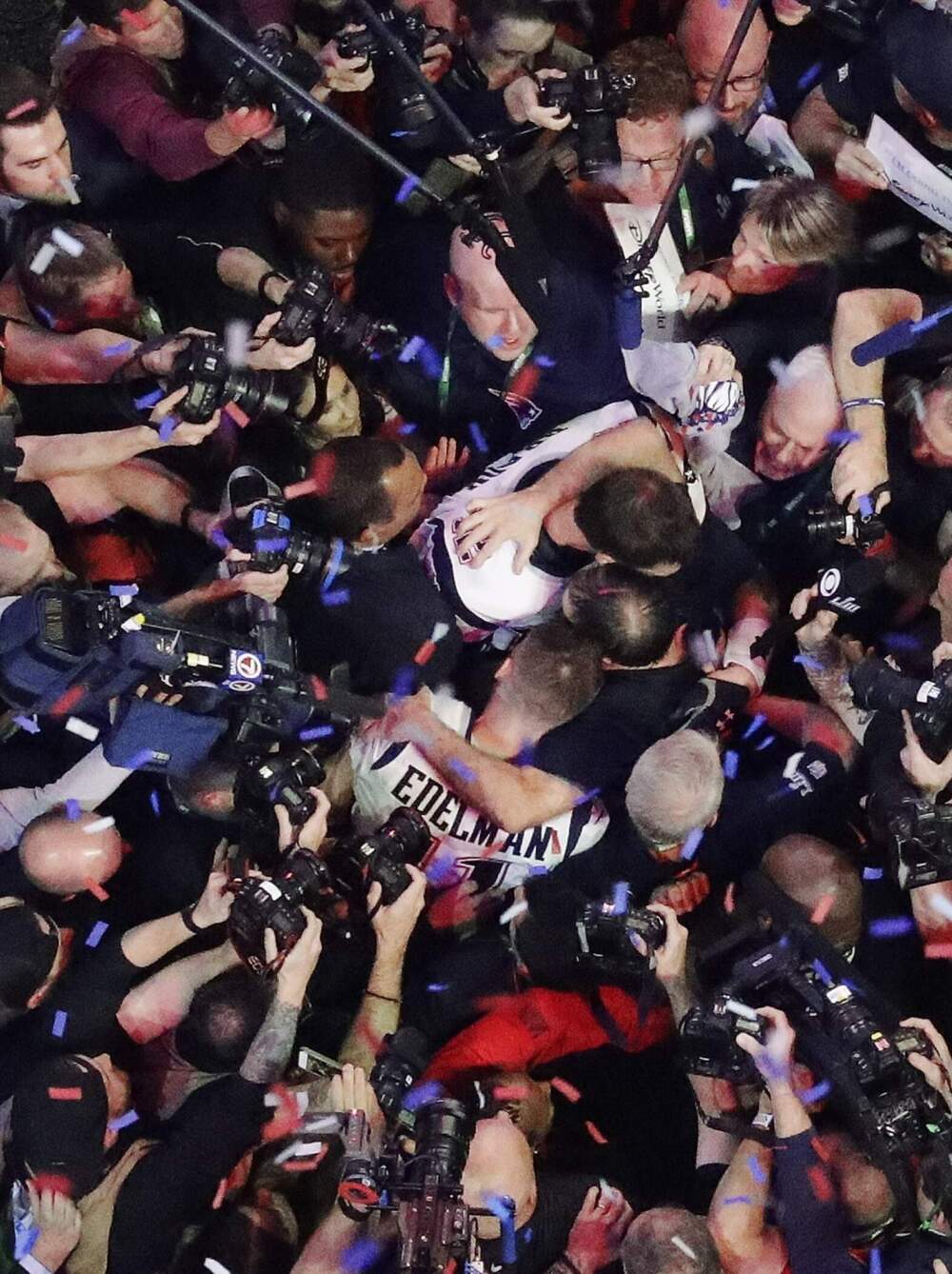 New England Patriots head coach Bill Belichick embraces New England Patriots' Julian Edelman and New England Patriots' Tom Brady after Super Bowl LIII. (Morry Gash/AP)