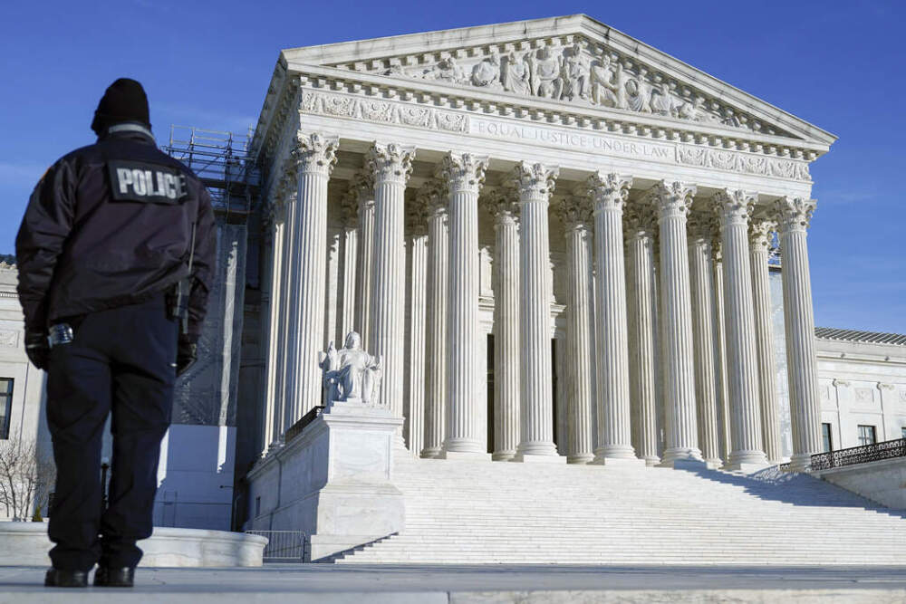 A U.S Supreme Court police officer patrols outside the U.S Supreme Court Friday, Jan. 5, 2024, in Washington. The Supreme Court will decide whether former President Donald Trump can be kept off the 2024 presidential ballot because of his efforts to overturn his 2020 election loss that culminated in the U.S. Capitol attack. (Mariam Zuhaib/AP)