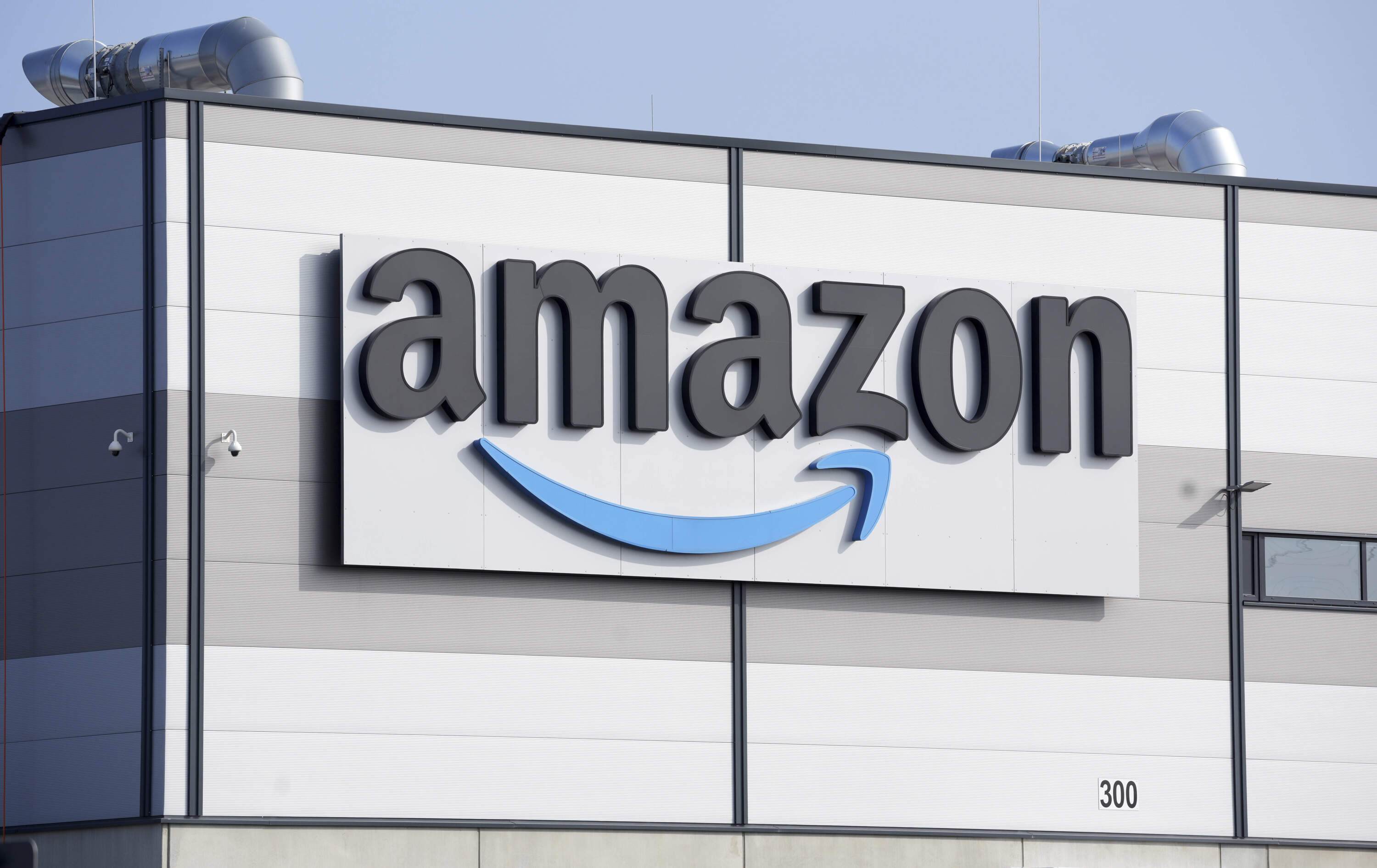 The Amazon company logo is seen on the facade of a building. (Michael Sohn/AP)
