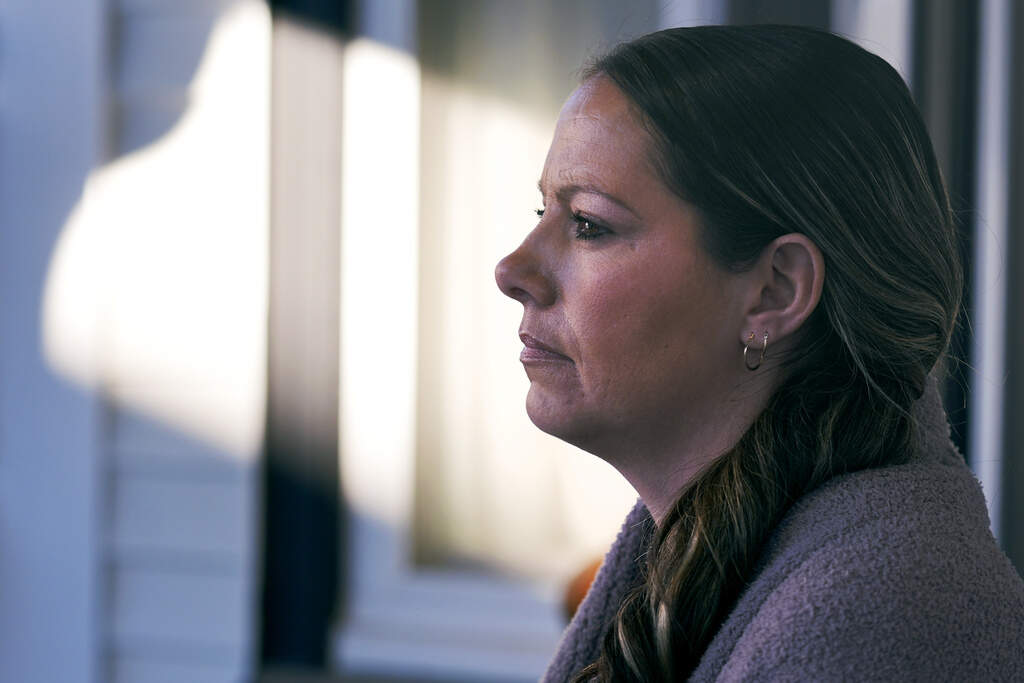 Kristina Amyot sits on the porch of a sober-living home, where she resided for about two years, at the Hope on Haven Hill, a residential, outpatient and recovery support service provider for pregnant, post-partum and parenting women. (Charles Krupa/AP)
