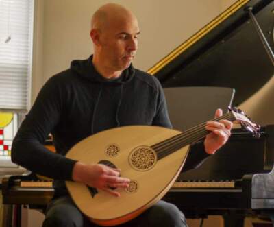 Eric Shimelonis playing the oud, the historical predecessor of the European lute. (credit: Rebecca Sheir)