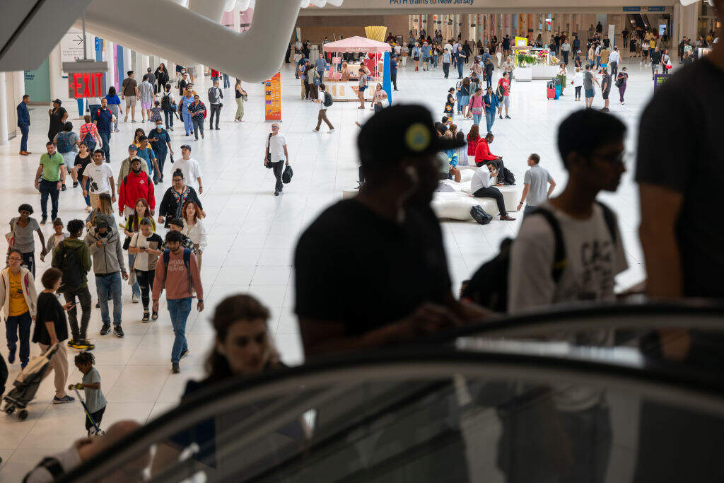 People walk and shop in a lower Manhattan shopping mall on September 13, 2023 in New York City. Newly released numbers by the Labor Department’s consumer price index show that August inflation came in higher than expected, rising 3.7% on a 12-month basis. (Photo by Spencer Platt/Getty Images)