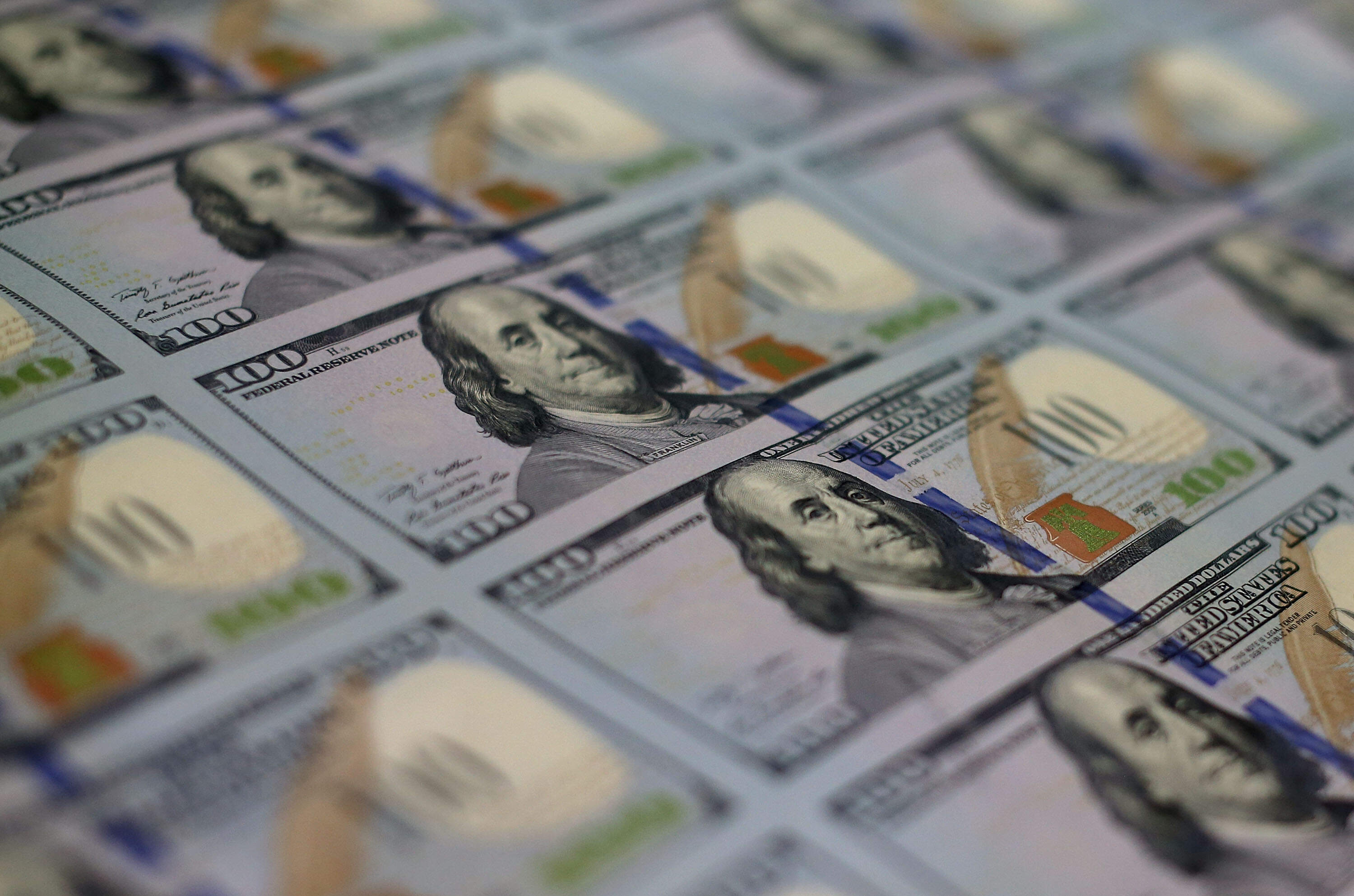Inflation is coming down, and interest rates may be ticking down soon as well. But economic forecasters say uncertainty is ever-present now. (Mark Wilson/Getty Images)