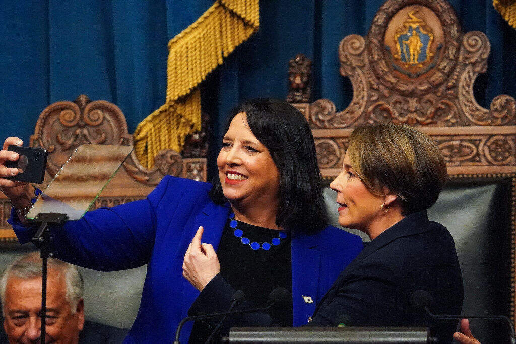 Massachusetts Gov. Healey and Lieutenant Gov. Driscoll take a selfie during her first State of the Commonwealth Address. (Photo by Barry Chin/The Boston Globe via Getty Images)