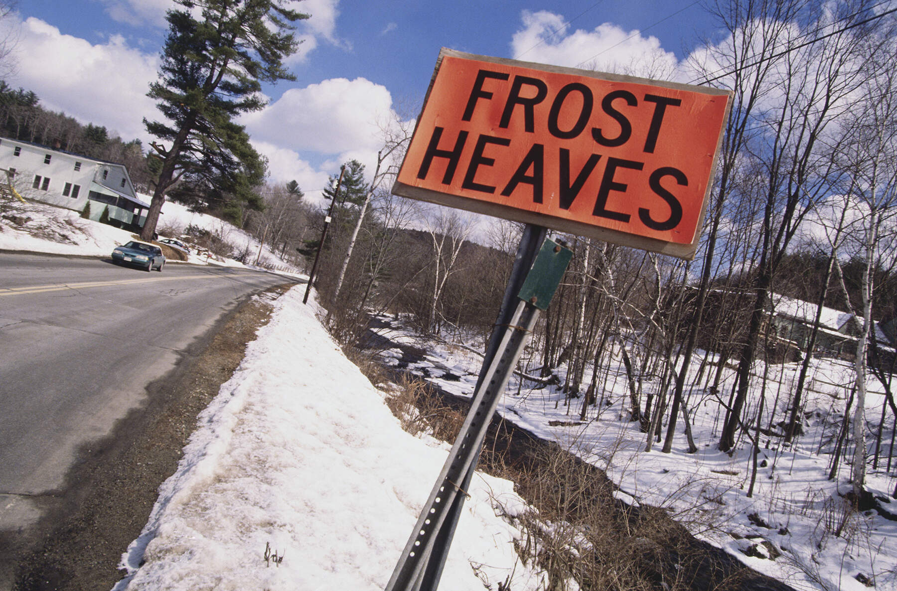 "Frost Heaves" sign along a snowy road. (Photo by © Viviane Moos/CORBIS/Corbis via Getty Images)