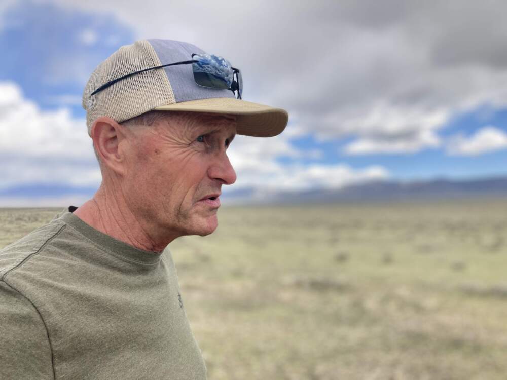 Mike Cox has been a biologist with the Nevada Department of Wildlife for 30 years. In that time he’s watched horse herd sizes boom and warns “the ecosystem is going to collapse. I would give parts of Nevada a decade. It's all it's got left.” (Courtesy of Ashley Ahearn)