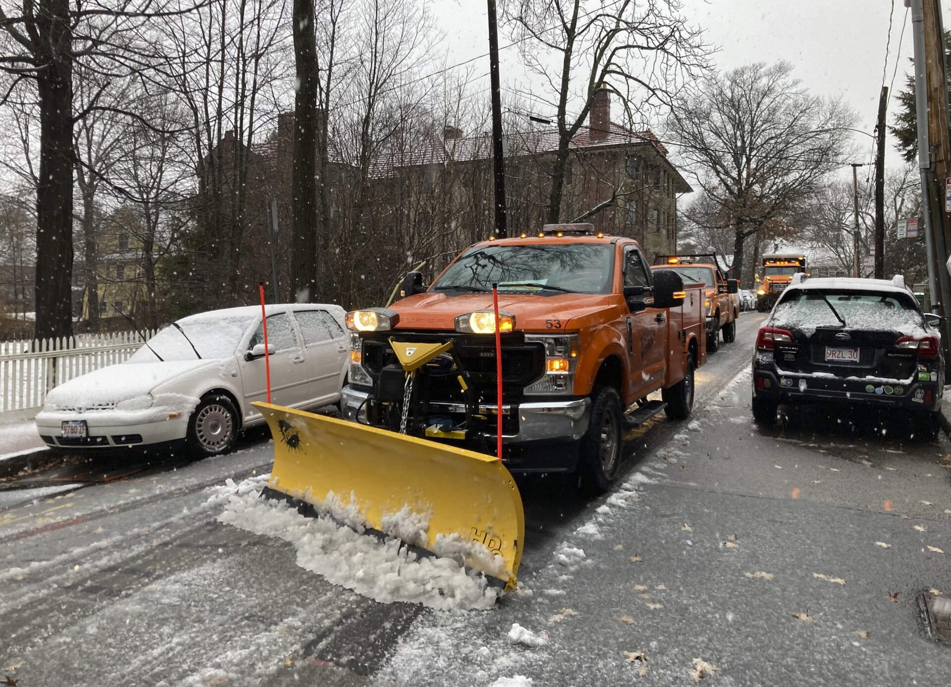A plow clears snow and slush from sidewalks Sunday in Cambridge, Mass. as a storm bringing a wintry mix of precipitation bears down on the New England region. (Steve LeBlanc/AP)