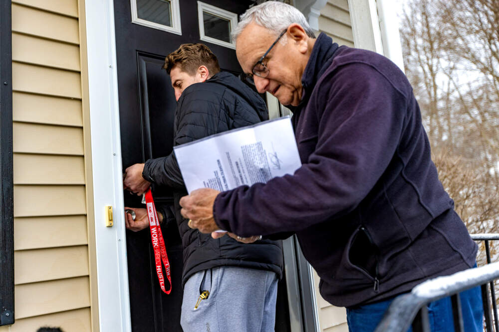 A Plymouth County constable oversees an eviction in Rockland. (Jesse Costa/WBUR)