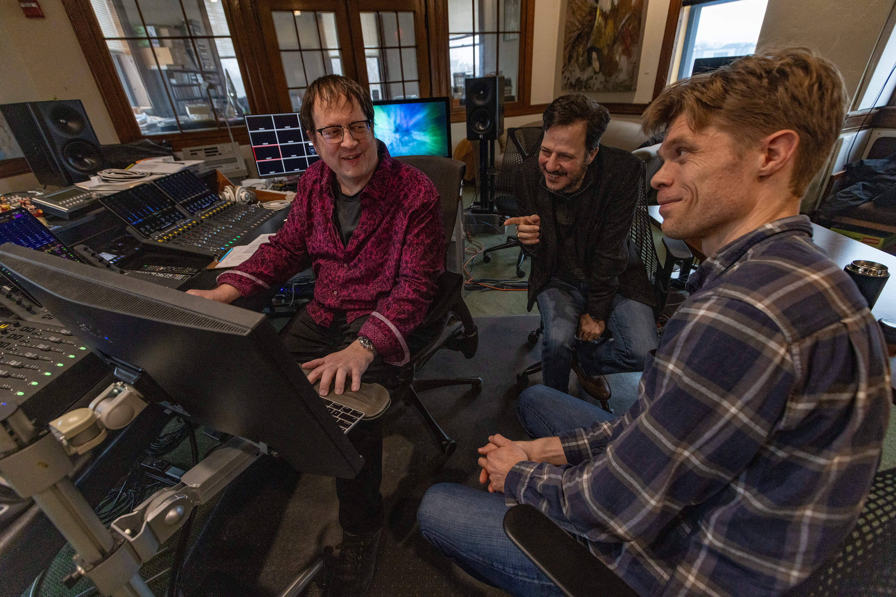 Recording engineer John Weston, Composer Mehmet Ali Sanlikol and producer Jesse Lewis listen to a track from their Grammy-nominated recording "A Gentleman of Istanbul” in the studio at Futura Productions in Roslindale. (Jesse Costa/WBUR)