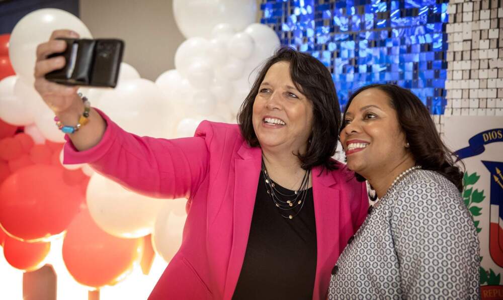 Massachusetts and Rhode Island Lt. Governors Kim Driscoll and Sabina Matos pause for a selfie at the First Annual Dominican Independence Day Breakfast in Boston. (Robin Lubbock/WBUR)