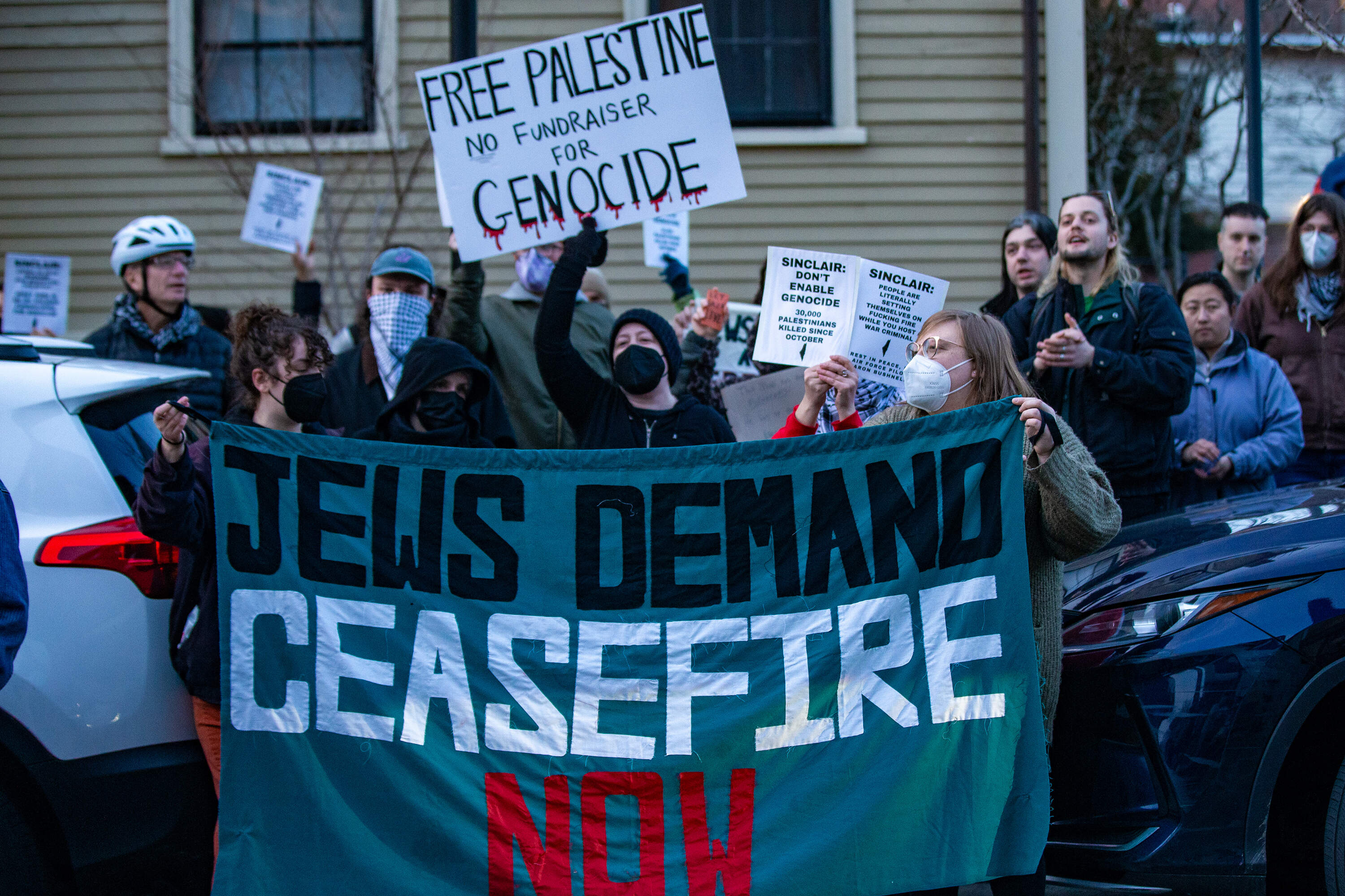 Protesters outside The Sinclair in Cambridge ahead of a Harvard Chabad concert raising funds to support the rebuilding of Israel. (Jesse Costa/WBUR)