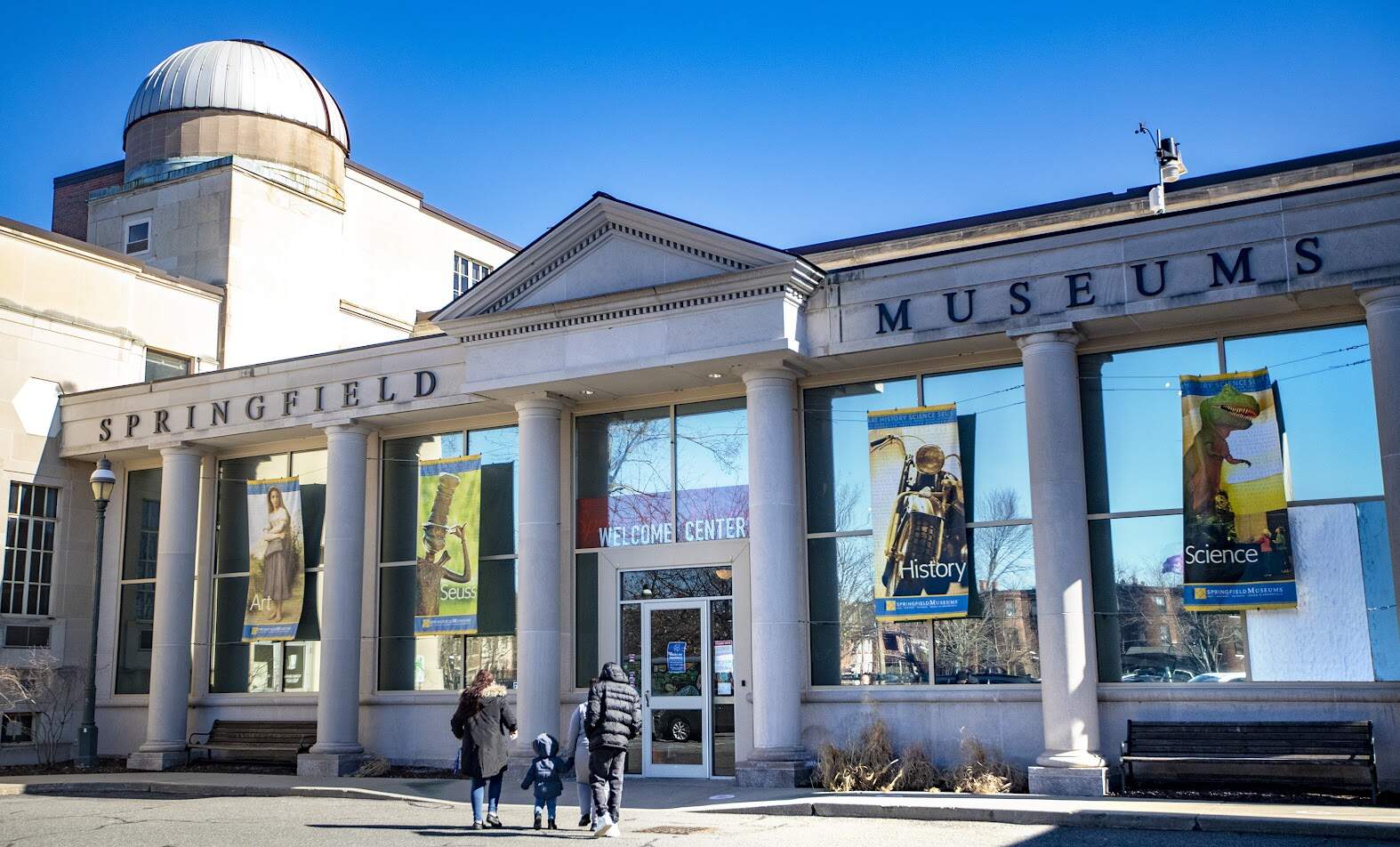 A family enters the Springfield Museums. (Jesse Costa/WBUR)