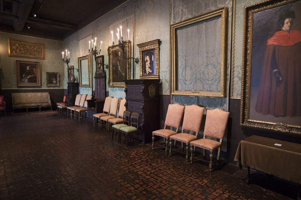 The back wall of the Dutch Room where the empty frames of two Rembrandt paintings hang; "Christ in the Storm on the Sea of Galilee," front, and Lady and Gentleman in Black." (Jesse Costa/WBUR)
