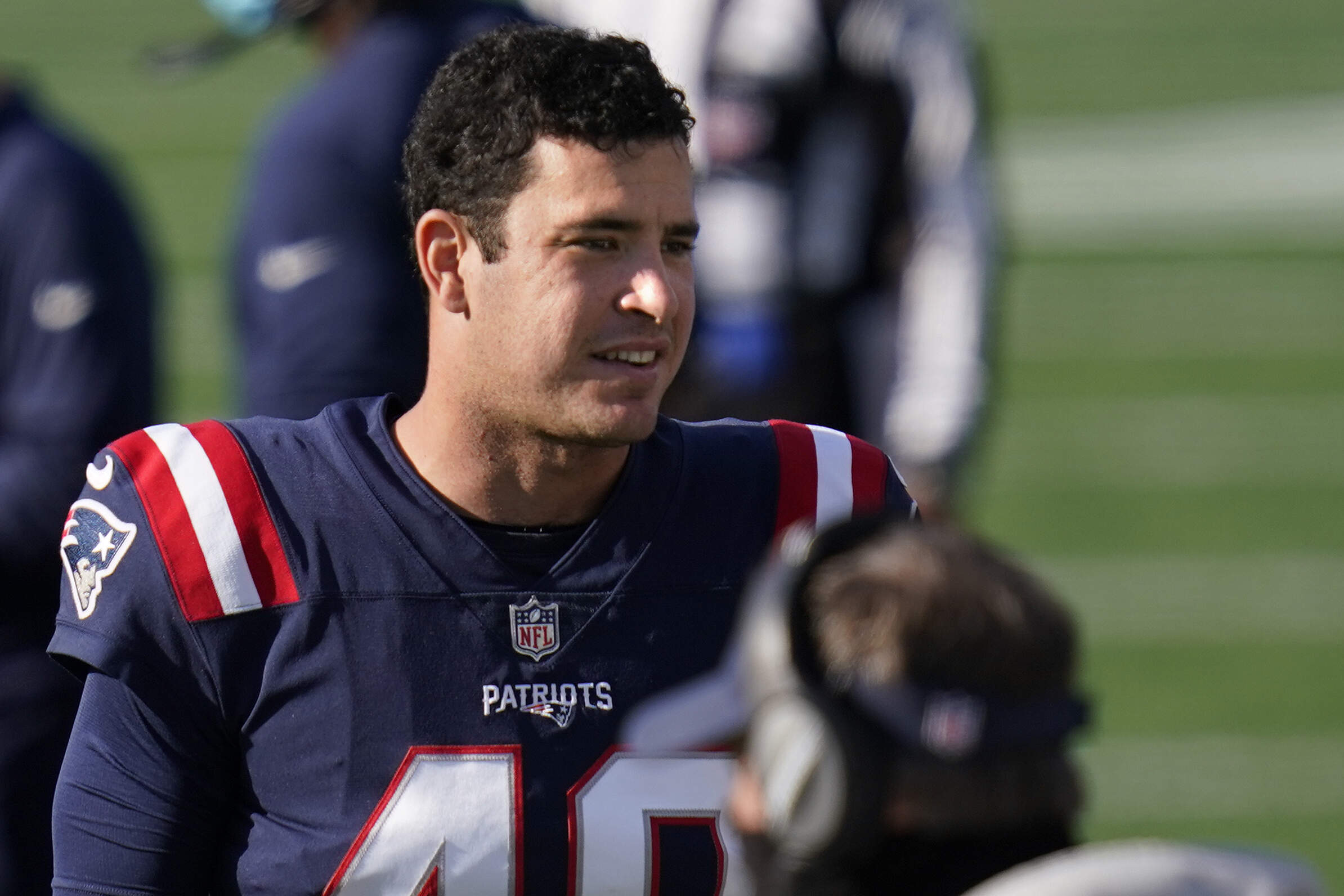 New England Patriots long snapper Joe Cardona watches from the sideline in the second half of an NFL football game. (Charles Krupa/AP)