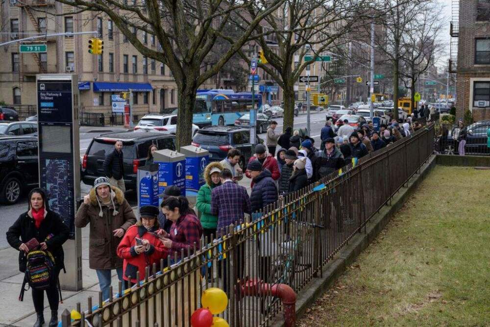 Ukrainian refugees wait in line to attend a job fair in the Brooklyn borough of New York on Feb. 1, 2023. (Angela Weiss/AFP via Getty Images)