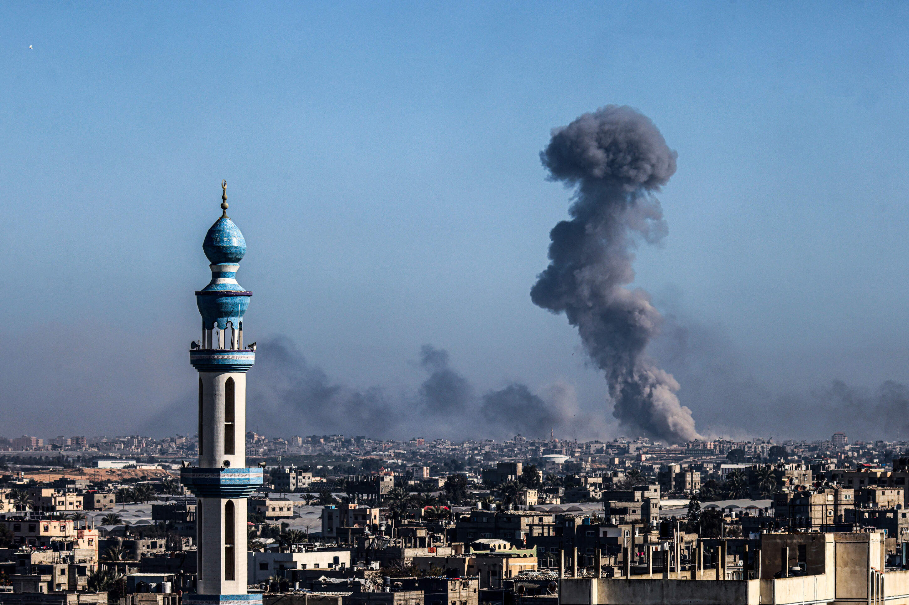 A picture taken from Rafah shows smoke billowing during Israeli bombardment over Khan Yunis in the southern Gaza Strip on Feb. 11, 2024, amid the ongoing conflict between Israel and the Palestinian Hamas militant group. (Said Khatib/AFP via Getty Images)