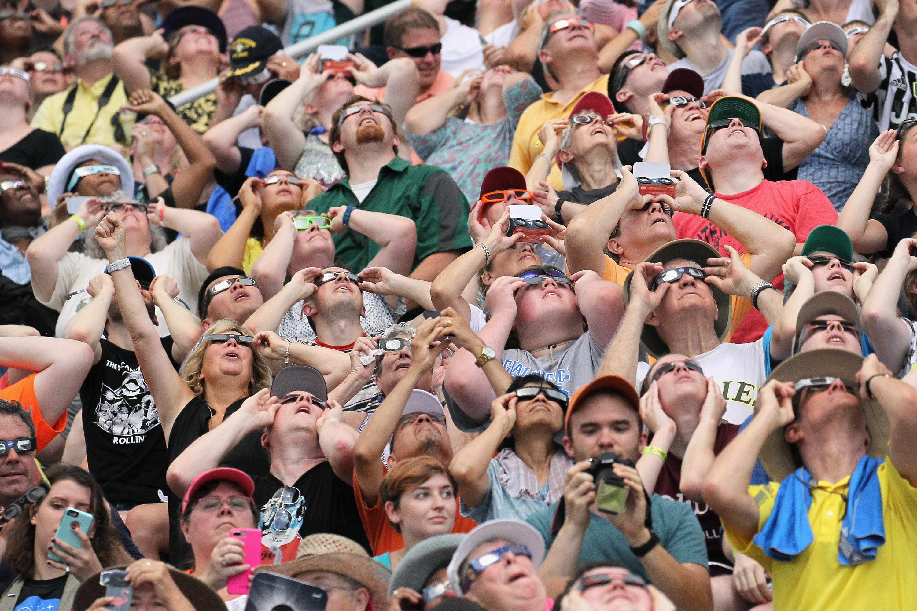 People watch the solar eclipse at Saluki Stadium on the campus of Southern Illinois University on Aug. 21, 2017. (Scott Olson/Getty Images)