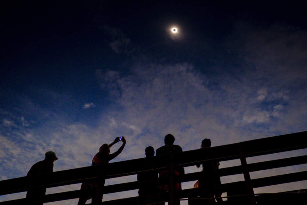 People watch a solar eclipse on Aug. 21, 2017 in Isle of Palms, South Carolina. (Pete Marovich/Getty Images)