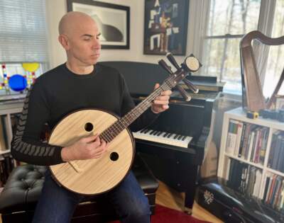 Eric Shimelonis plays the ruan, a Chinese lute with four strings and 24 frets. (Credit: Rebecca Sheir)