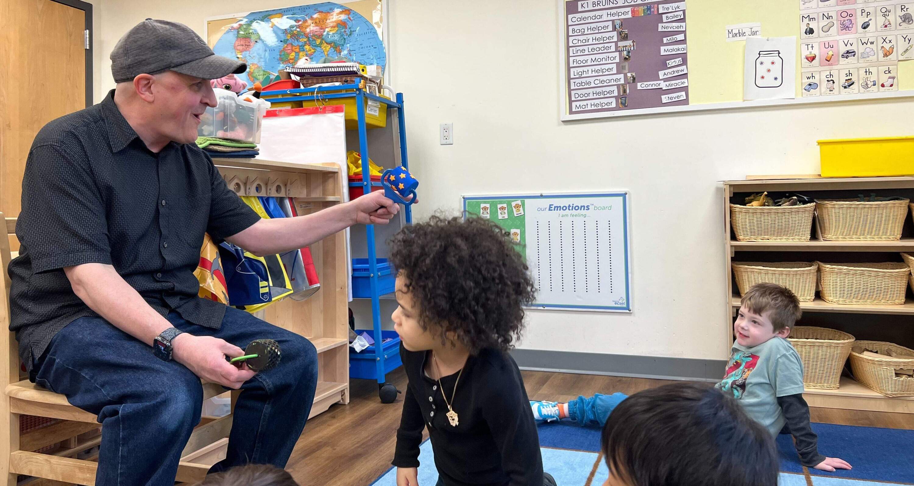 Matthew Wallace does circle time with his students at Ellis Early Education. (Ashley Locke/Here & Now)