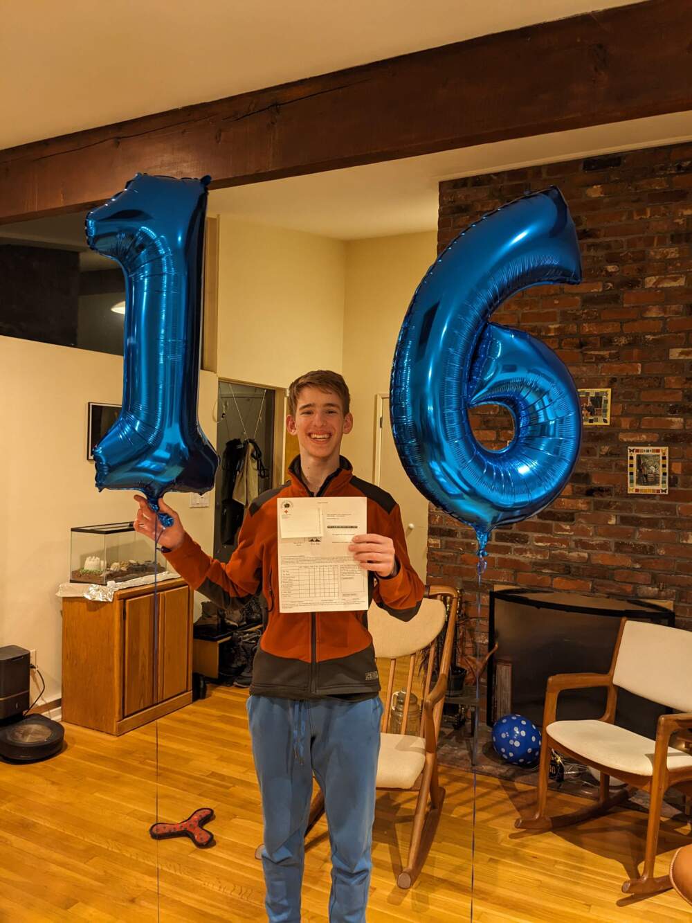 The author's son, Simon Mintz, celebrates getting his learner's permit, a day after his 16th birthday. (Courtesy Linda K. Wertheimer)
