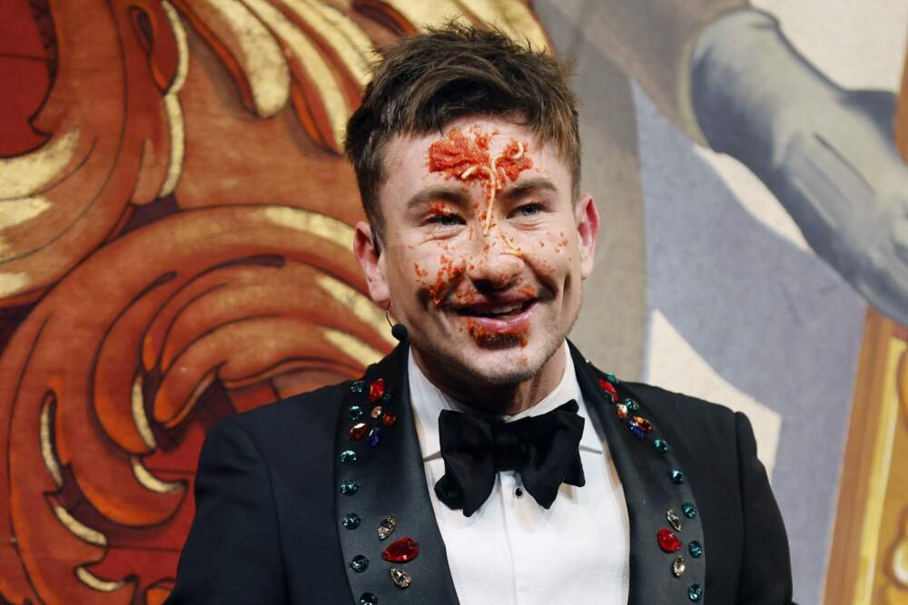Harvard University's Hasty Pudding Theatricals Man of the Year Barry Keoghan reacts after plunging his face into a plate of spaghetti in Cambridge, Mass. (Michael Dwyer/AP)