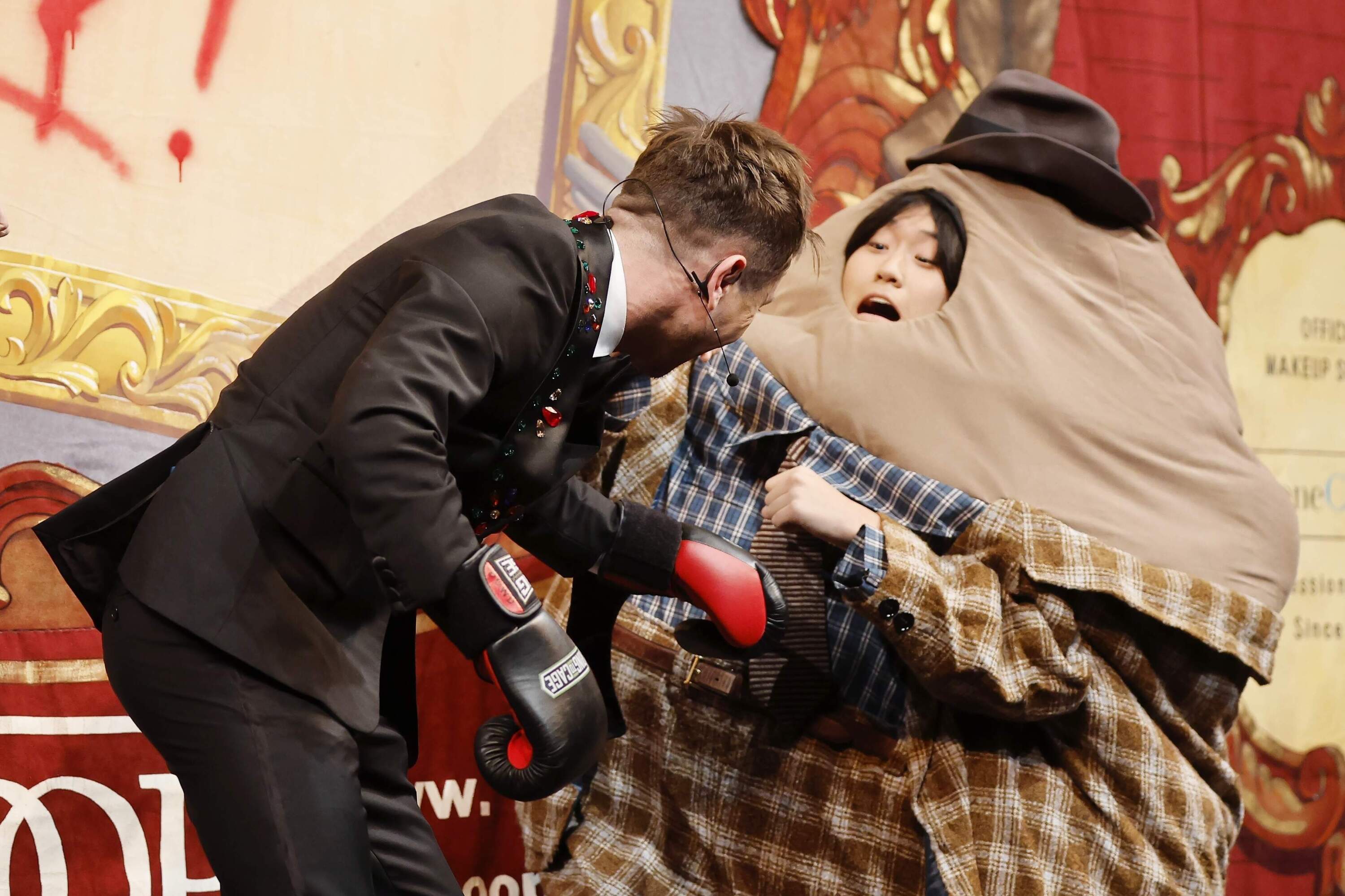 Barry Keoghan, left, boxes with Mr. Irish Potato Famine during a roast. (Michael Dwyer/AP)