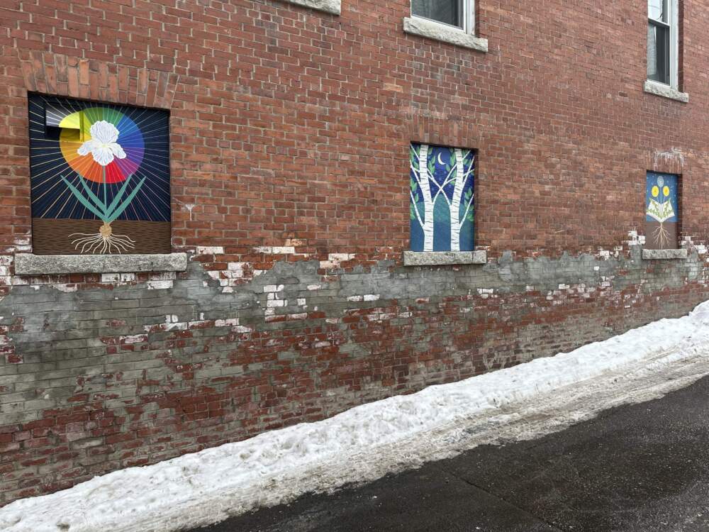 Murals deemed objectionable by some residents are displayed on the side of building in Littleton, N.H. (Nick Perry/AP)