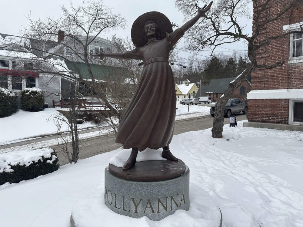 A bronze statue of Pollyanna sits outside the Littleton public library to honor the 1913 book by local author Eleanor H. Porter, whose main character came to define relentless optimism. (Nick Perry/AP)