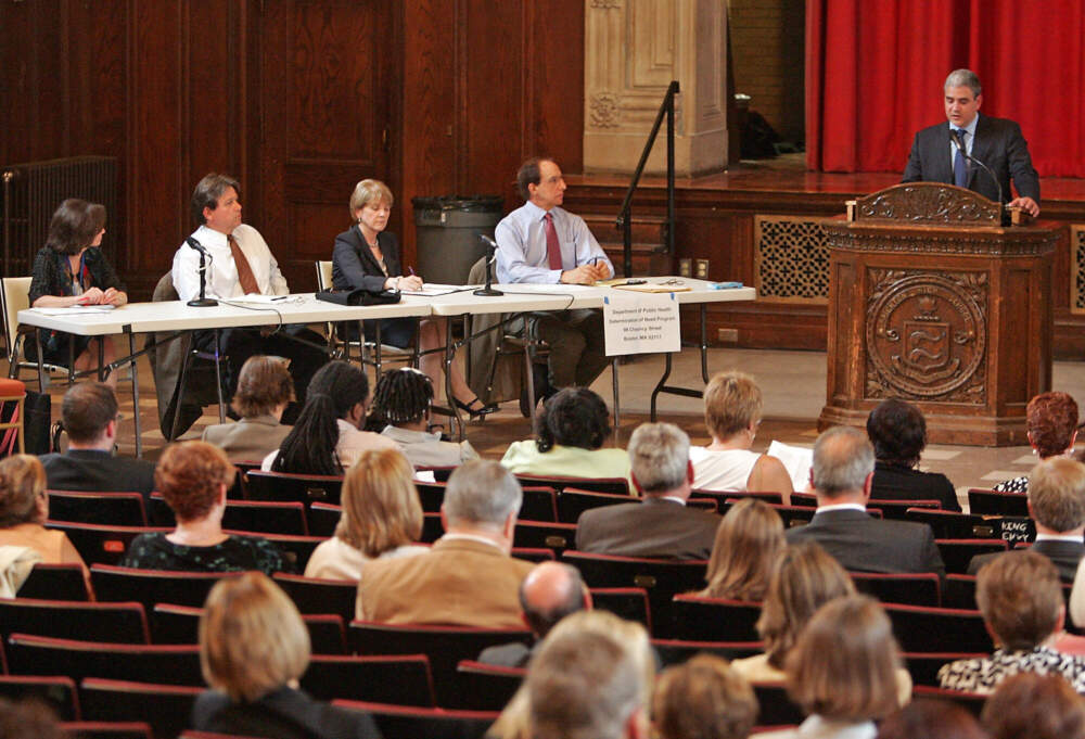 State Attorney General Martha Coakley and Carthis CEO Dr. Ralph de la Torre speak at a public hearing about the sale of Caritas Christi Health Care to a private investor on June 22, 2010. (Stuart Cahill/MediaNews Group/Boston Herald via Getty Images)