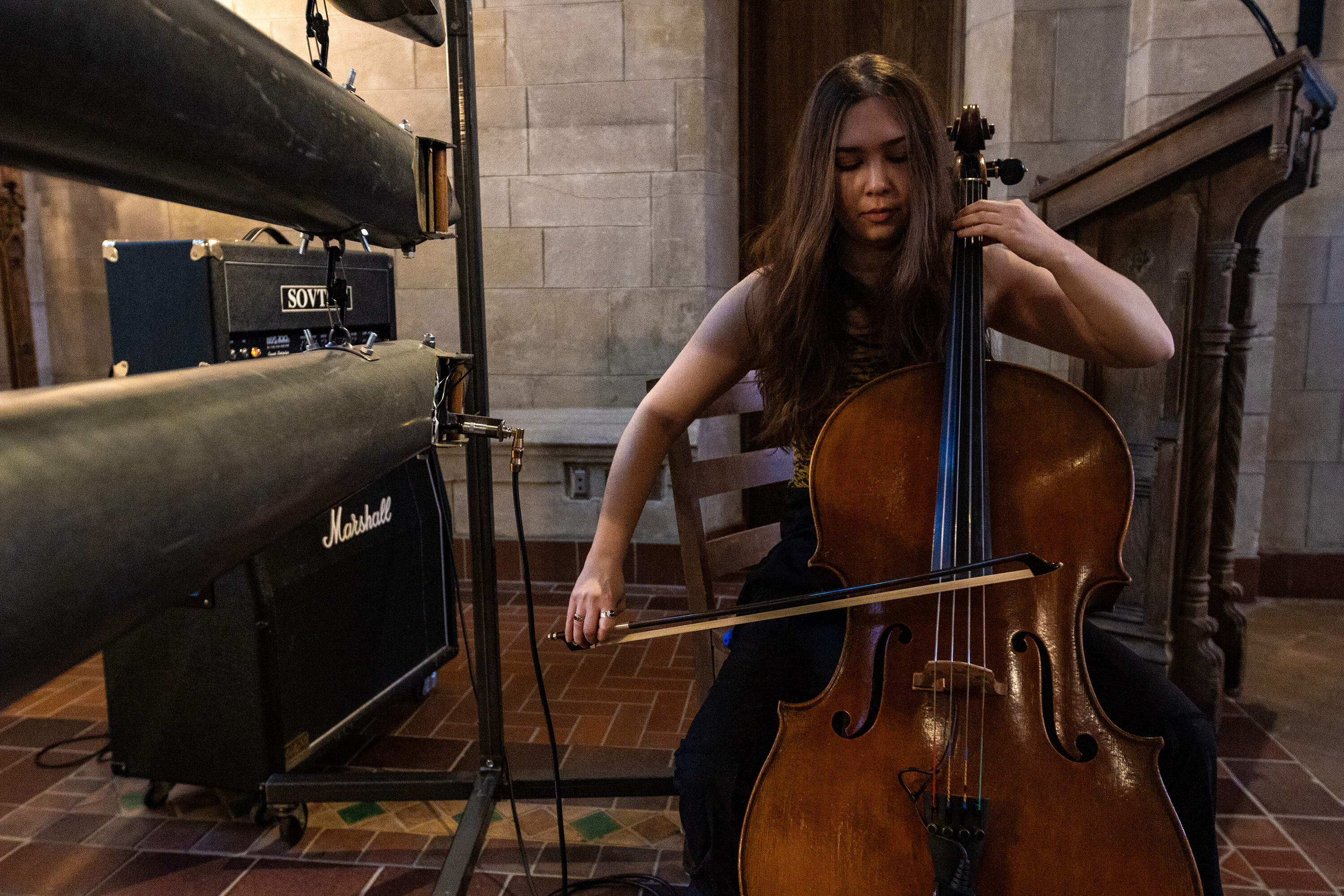 Artist-in-residence Eden Rayz plays the cello during a rehearsal at Bigelow Chapel in Mount Auburn Cemetery. (Jesse Costa/WBUR)