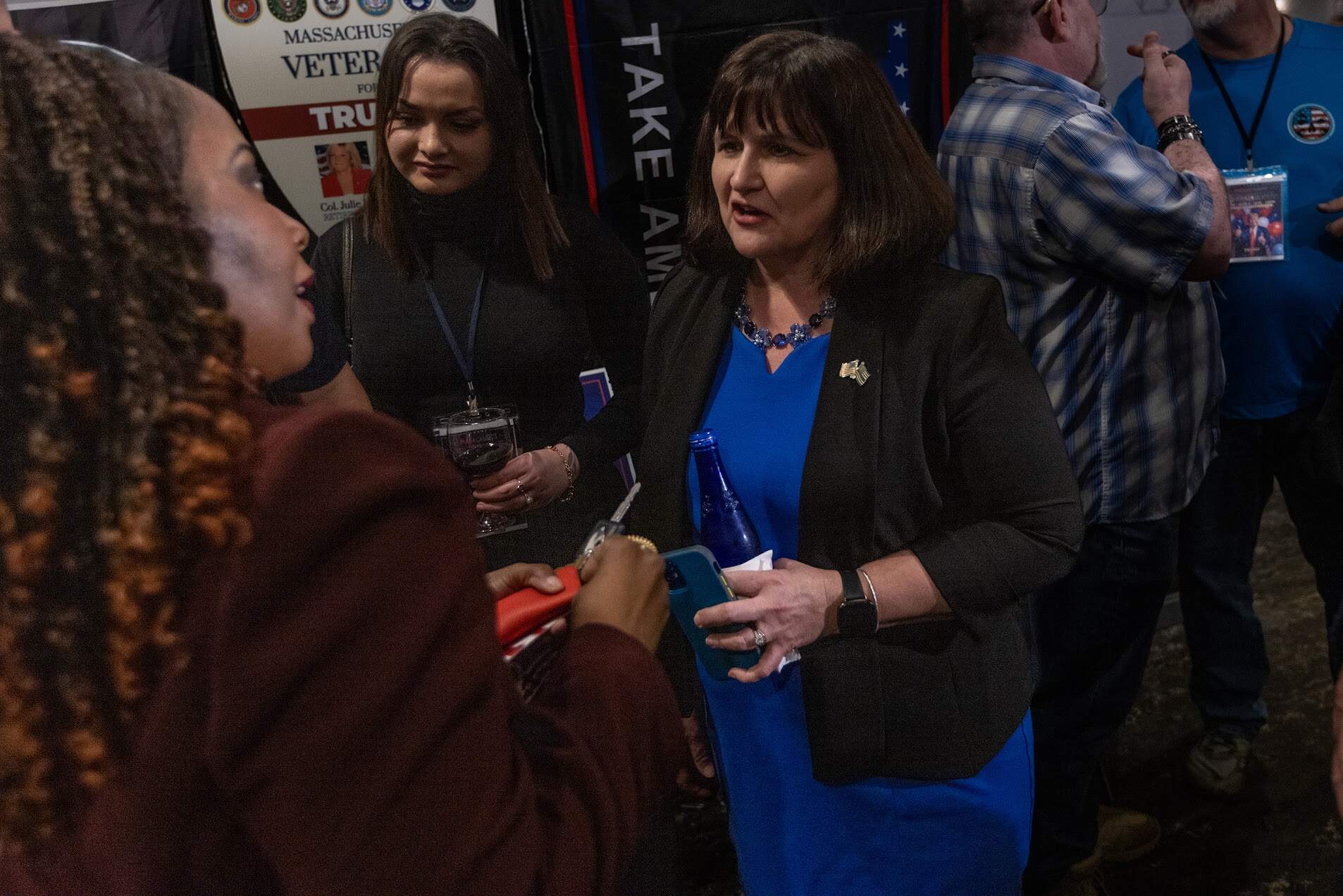 Massachusetts Republican Party chair Amy Carnevale speaks with a Trump supporter at an election watch party in Quincy. (Jesse Costa/WBUR)