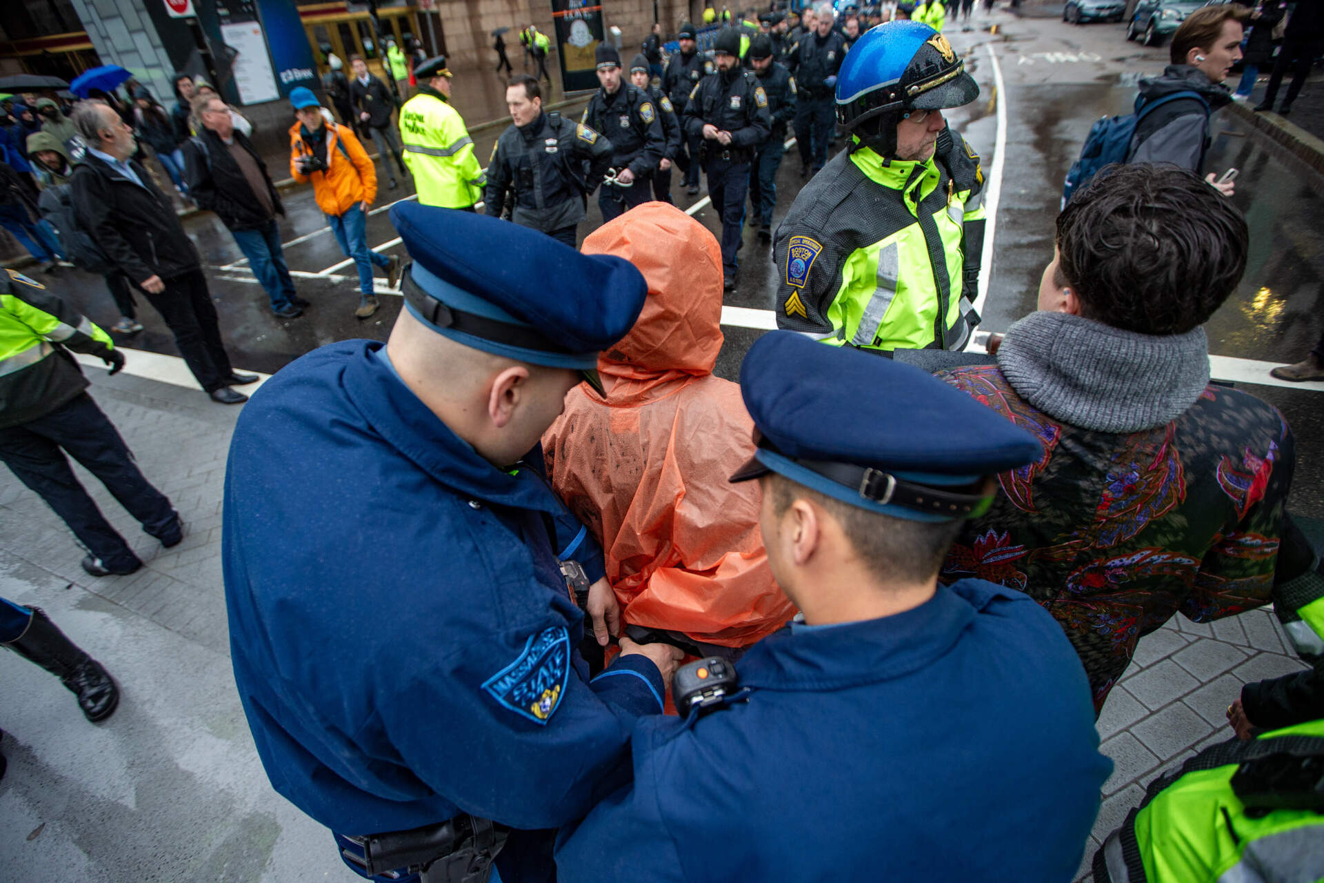 Massachusetts State Police troopers also assisted city police with arrests. (Jesse Costa/WBUR)