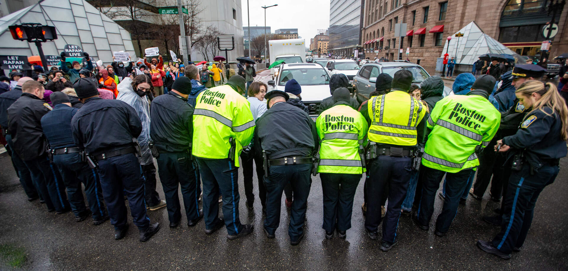 Boston Police arrest protesters on Thursday. (Jesse Costa/WBUR)