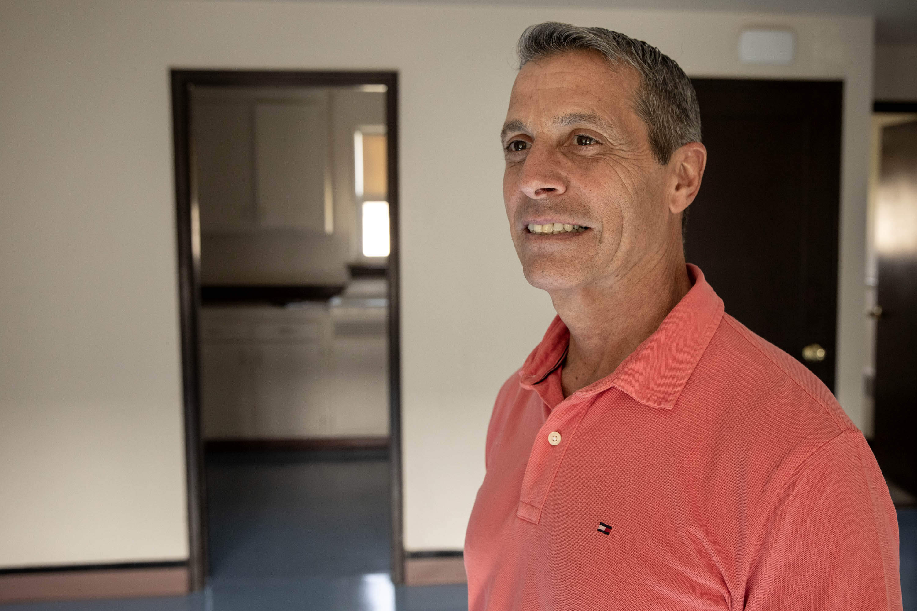 Kevin Sbardella, executive director of the Fall River Housing Authority, at a public housing apartment in Fall River, Mass. (Robin Lubbock/WBUR)