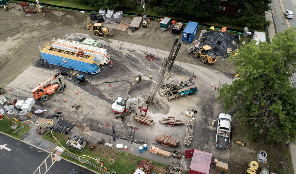 A drill bores geothermal wells for Eversource's networked geothermal pilot project in Framingham. (Robin Lubbock/WBUR)