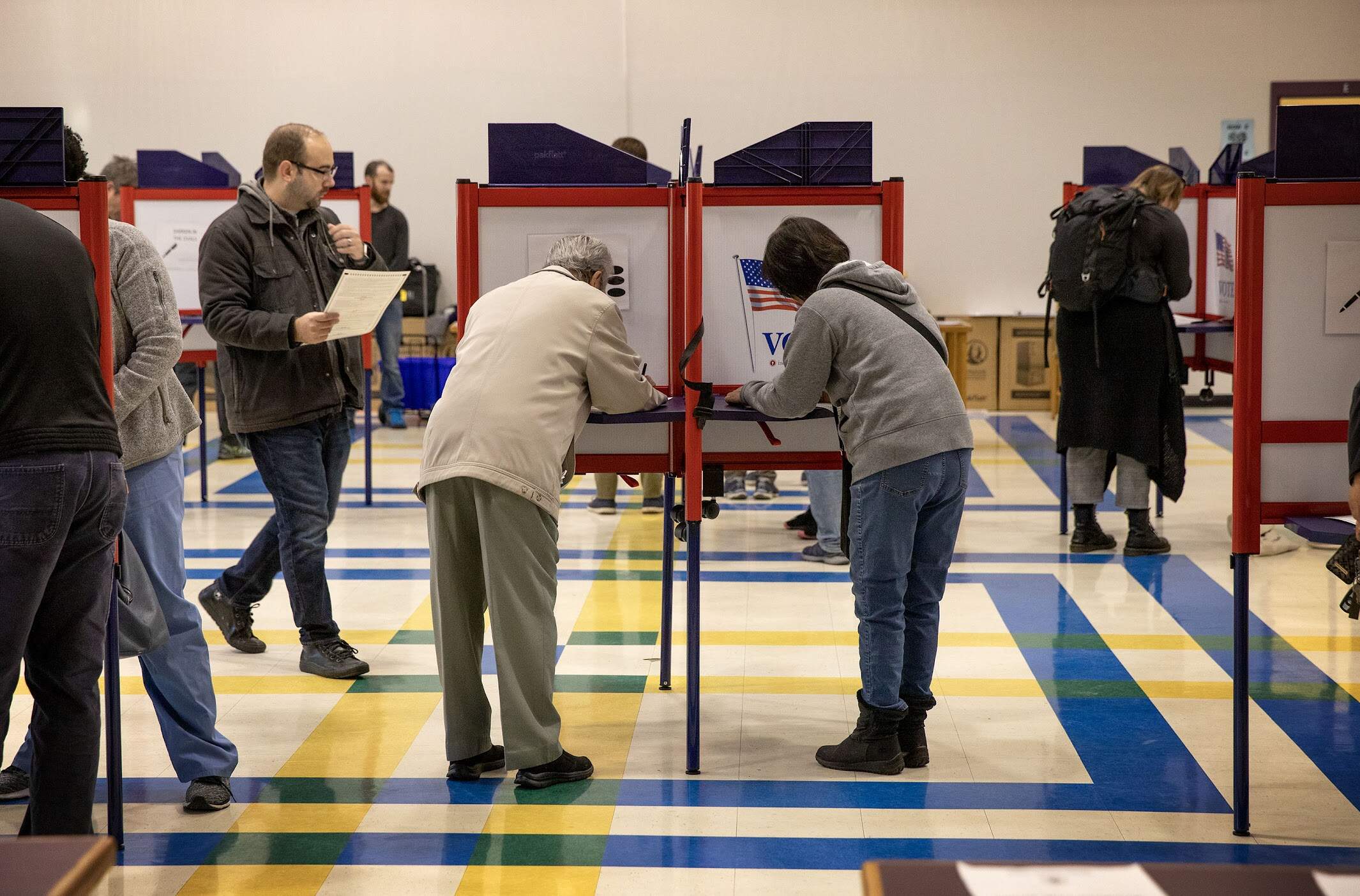 Medford voters fill the voting booths at Missituk Elementary School in 2022. (Robin Lubbock/WBUR)